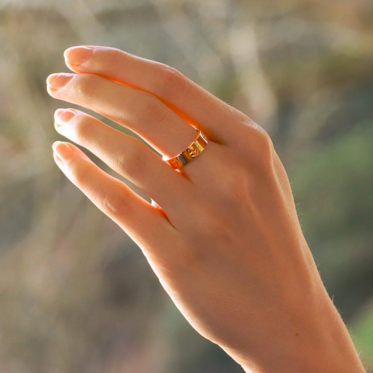 A classic Cartier Love ring set in 18k rose gold.

The Love collection is a firm favorite of many mainly due to the simple yet beautiful design. The ring is composed of a 5.5-millimetre band with six individual nail motifs engraved within it. The