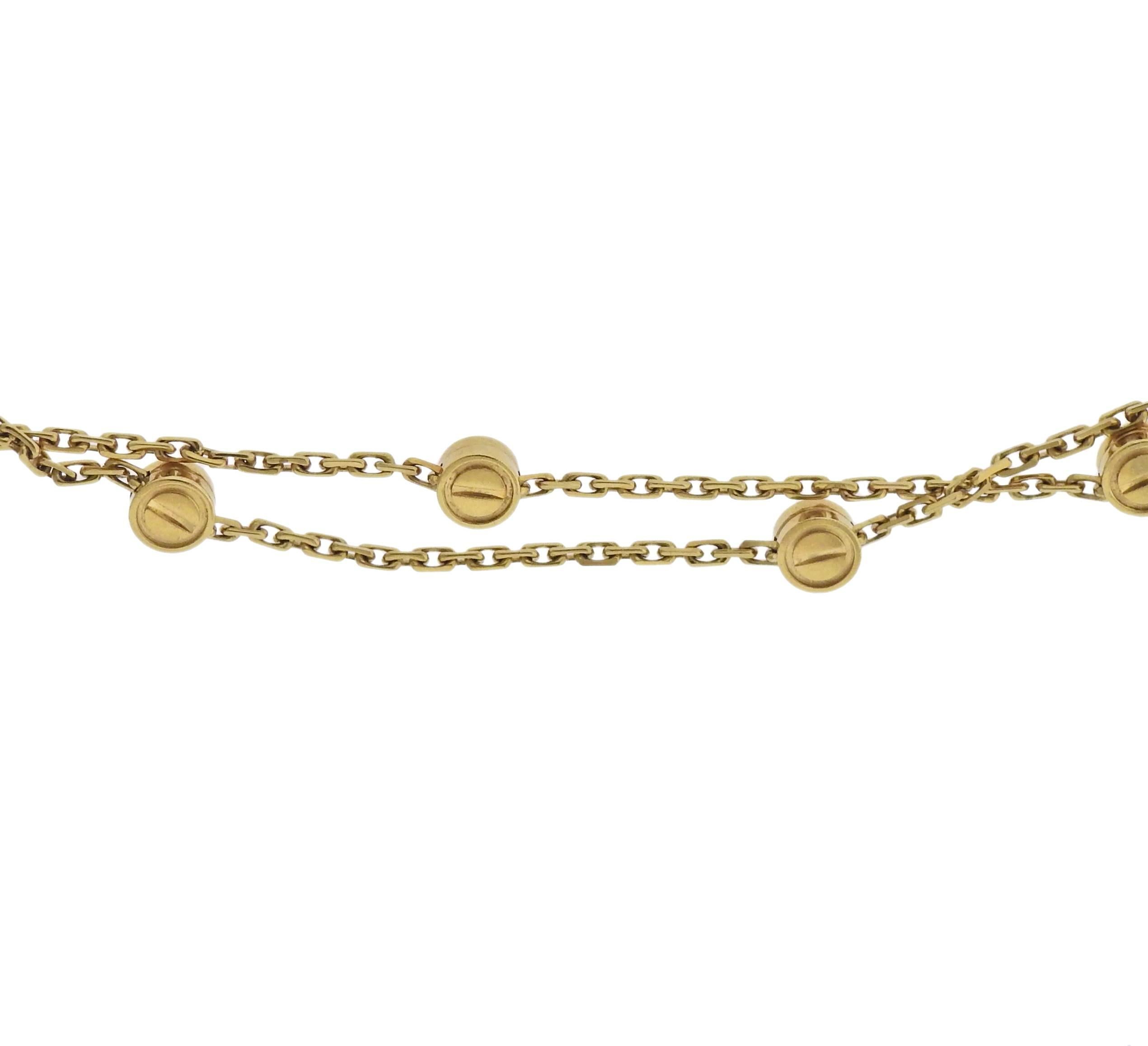 Rare vintage 18k yellow gold long Love station necklace, crafted by Cartier. Necklace is 46