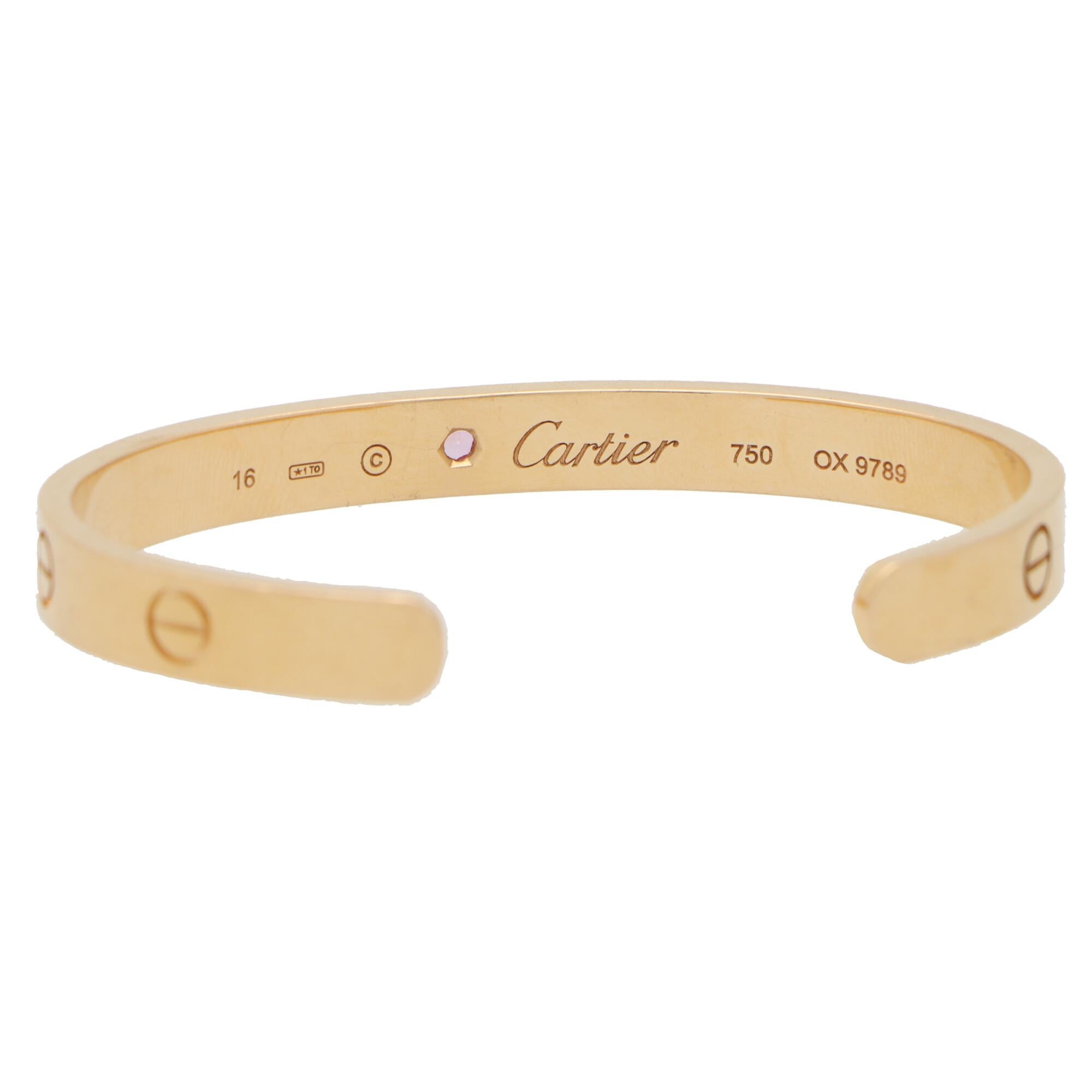 A classic Cartier Love U torque bangle set in 18k rose gold.

The Love collection is a firm favourite of many mainly due to the simple, beautiful and elegant design. The bangle is composed of a 6-millimetre band with eight individual nail motifs