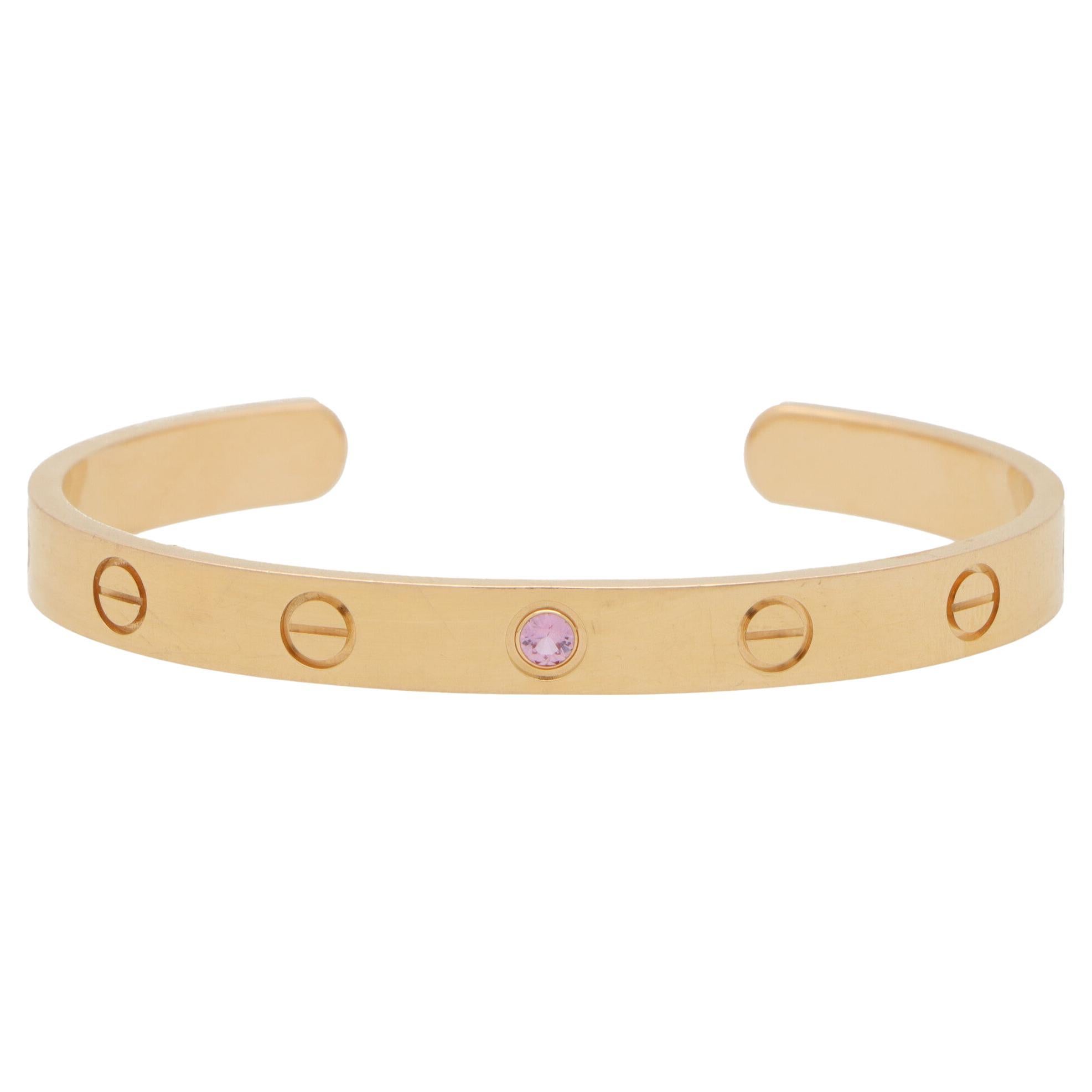 Vintage Cartier Love U Pink Sapphire Torque Bangle in Yellow Gold