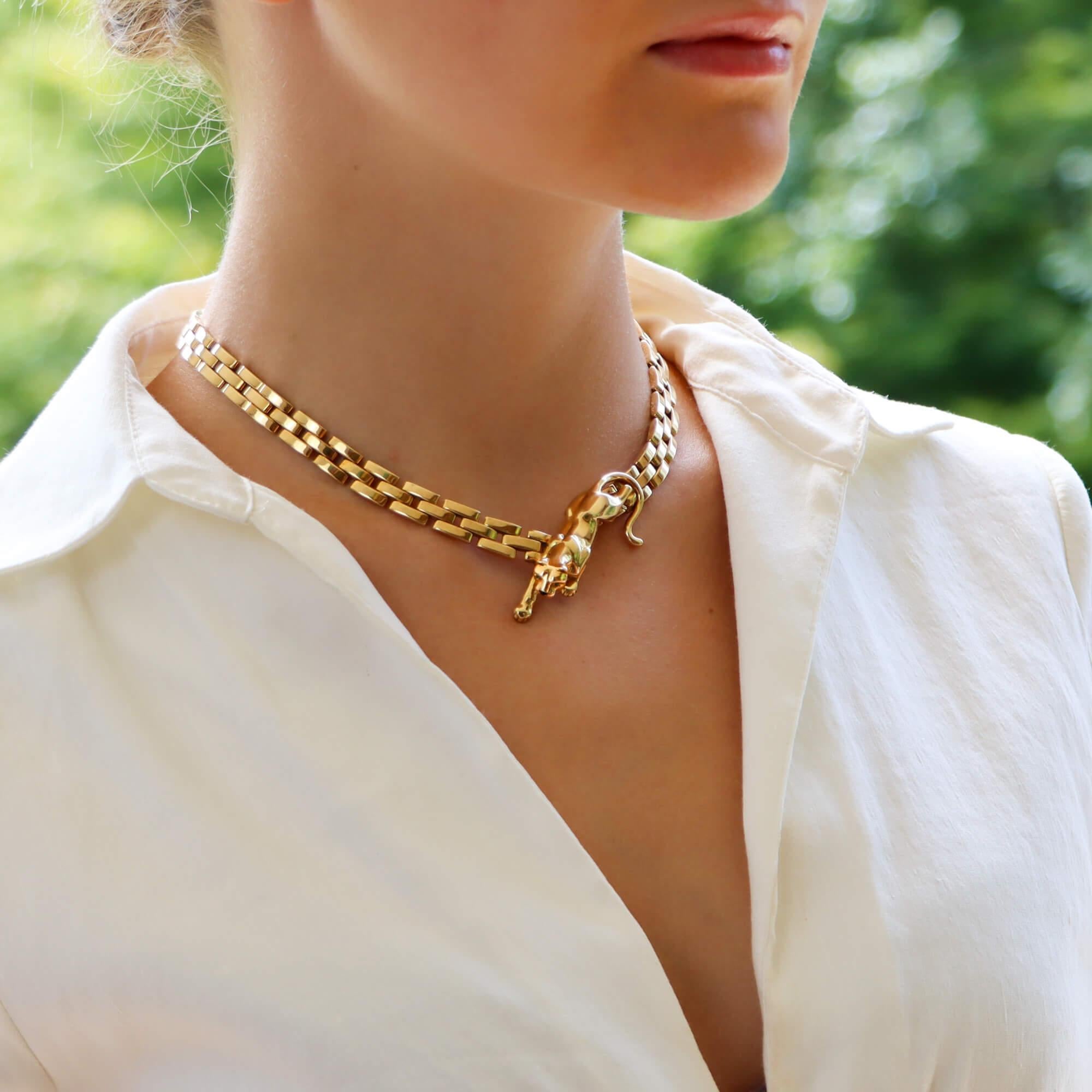 A beautiful vintage Cartier Maillon walking Panthère necklace set in solid 18k yellow gold.

The necklace is composed of exactly 96 solid gold flat links, connected in the Maillon Panthère brick link design. Set centrally within the necklace is the