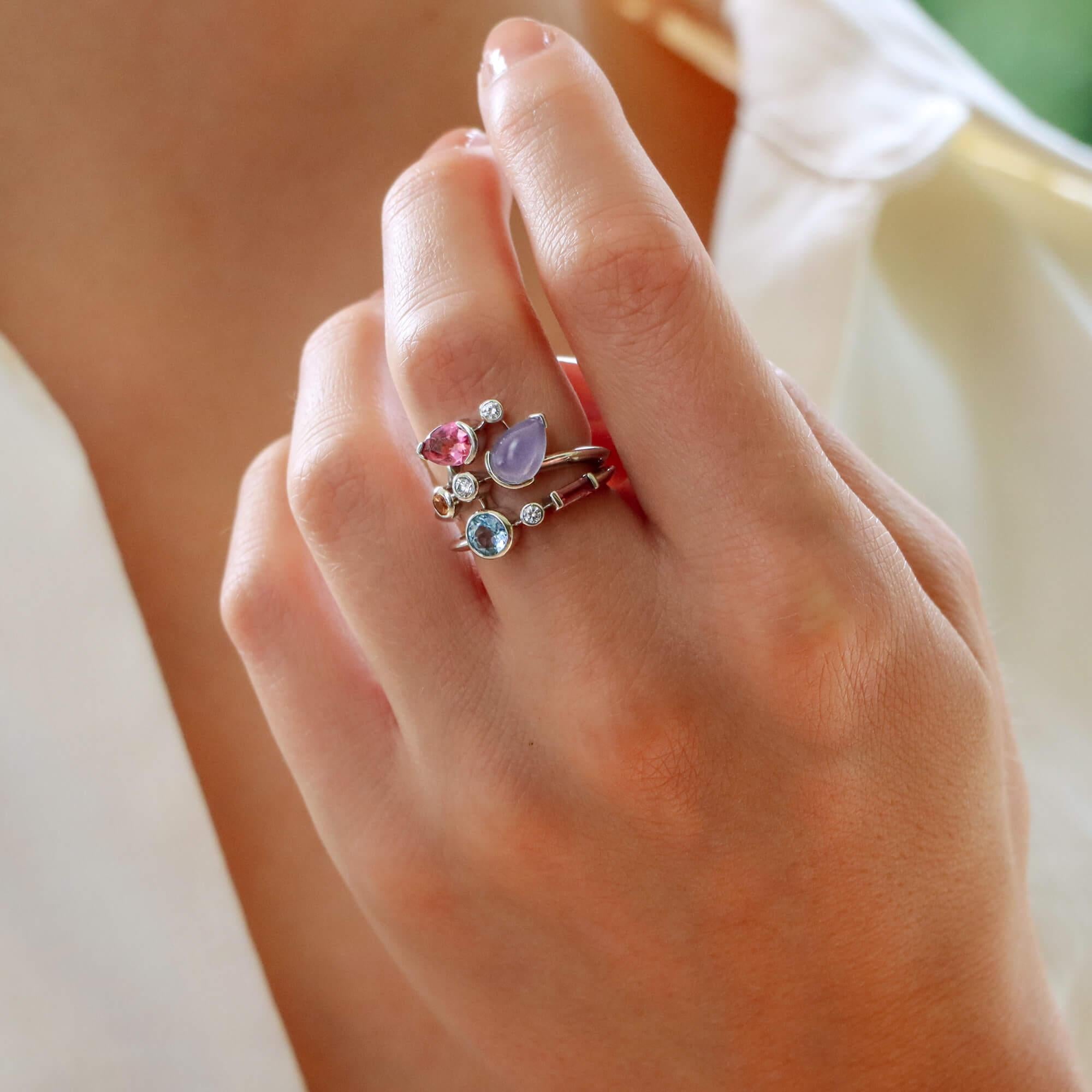 A rather unique vintage Cartier Meli Melo dress ring set in platinum. 

The ring is designed in a constellation format, set with a variety of beautiful precious and semi-precious gemstones. These gemstones include three round brilliant cut diamonds,