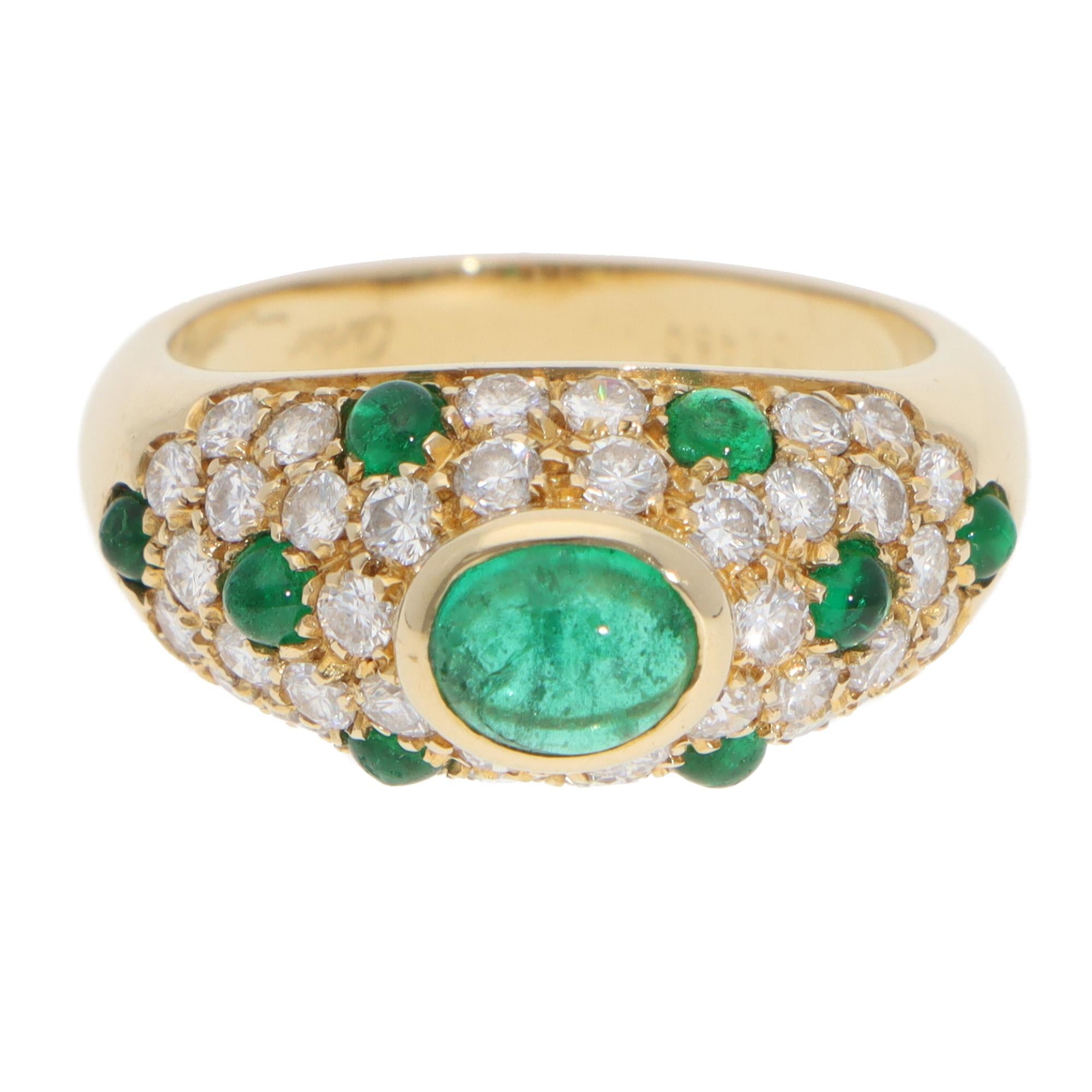 An extremely striking vintage Cartier diamond and emerald cabochon ring from the sought after ‘Mimi’ collection, set in 18k yellow gold.

From the now discontinued Mimi collection, this beautiful piece predominantly features and vibrant green