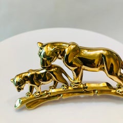 Cartier Broche panthère mère et enfant vintage en or 18 carats et yeux d'émeraude