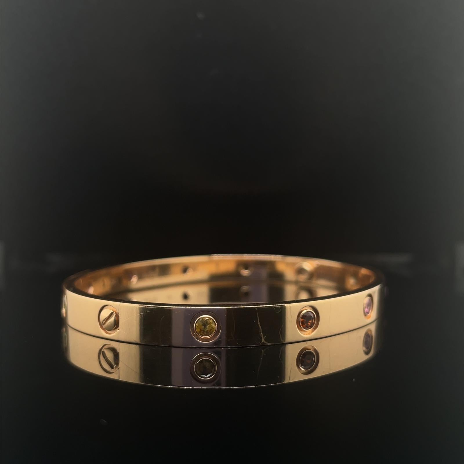 A classic vintage Cartier gem set Love bangle set in 18k rose gold.

The Love bangle is a timeless design, both elegant, enduring and comfortable to wear.

Designed with ten individual stones set in the place of where would have been the iconic Love