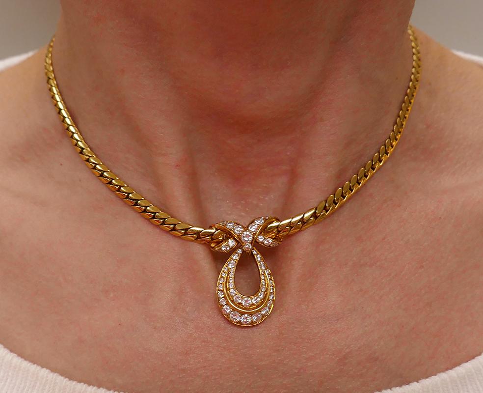        A lovely vintage Cartier 18 karat yellow gold diamond pendant necklace. Despite the dressy looking diamonds, this Cartier gold necklace is great for everyday wear.
The pear shape pendant embellished with two rows of diamonds. The center of
