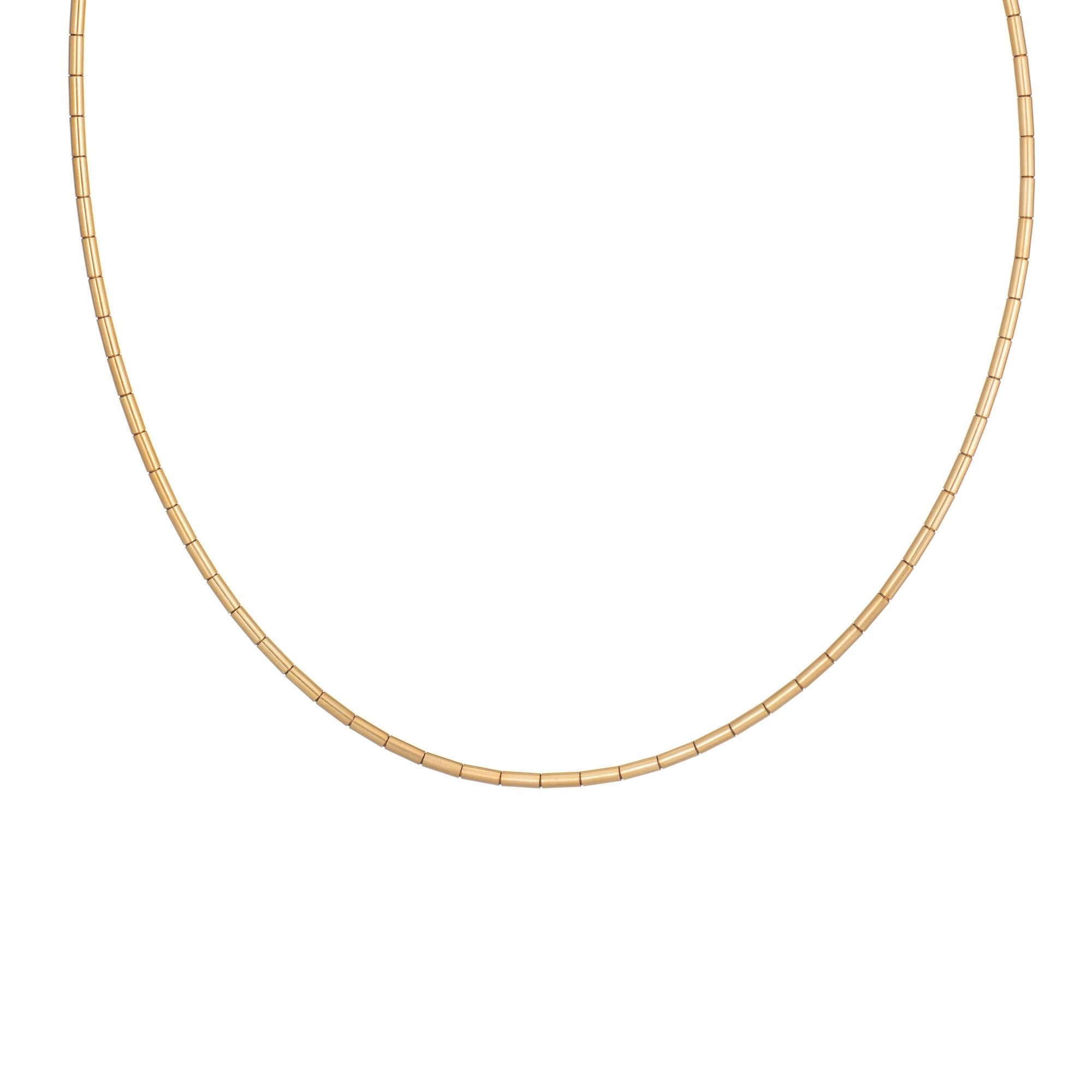 Stylish vintage Cartier necklace crafted in 18 karat yellow gold (circa 1999).  

The 15 1/2 inch necklace is designed as a choker to sit at the nape of the necklace. With a tubular link design the necklace is great worn alone (or add a pendant or