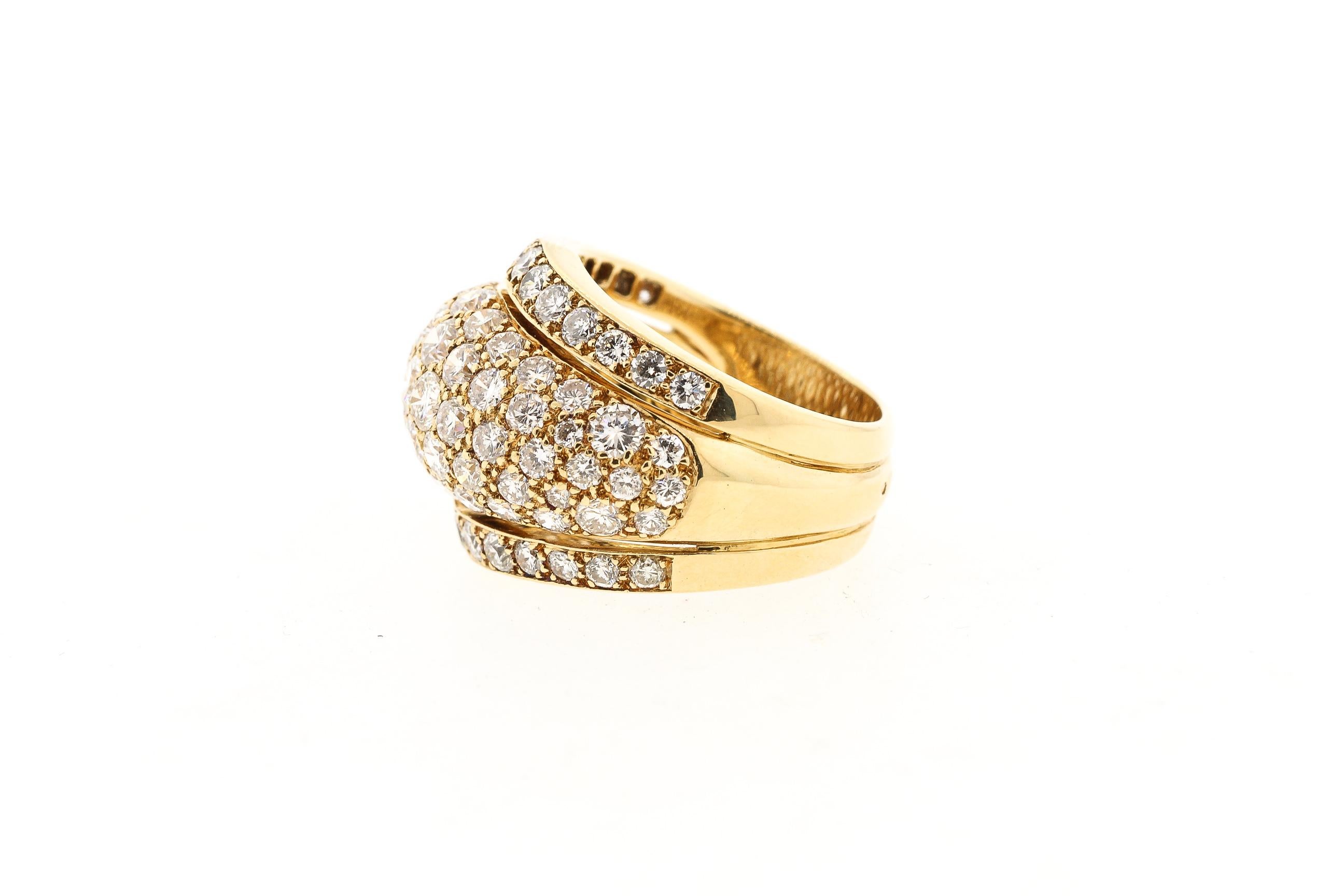 Vintage all diamond bombe ring from the Nigeria collection by Cartier. The ring is probably from the 1980s. The stunning ring is set with all pave diamonds of collection quality - F to G color and VS clarity. The diamonds weigh approximately 6