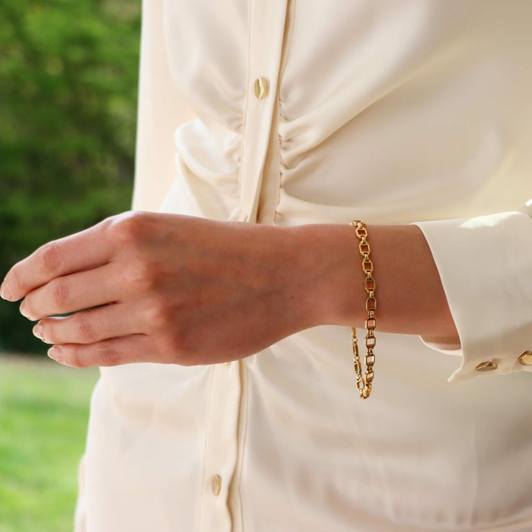 A vintage Cartier open link bracelet set in 18k yellow gold.

The bracelet is composed of 22 square shaped round open links; all of which are connected together by smaller oval shaped links. Due to the subtlety of the design, this piece could be