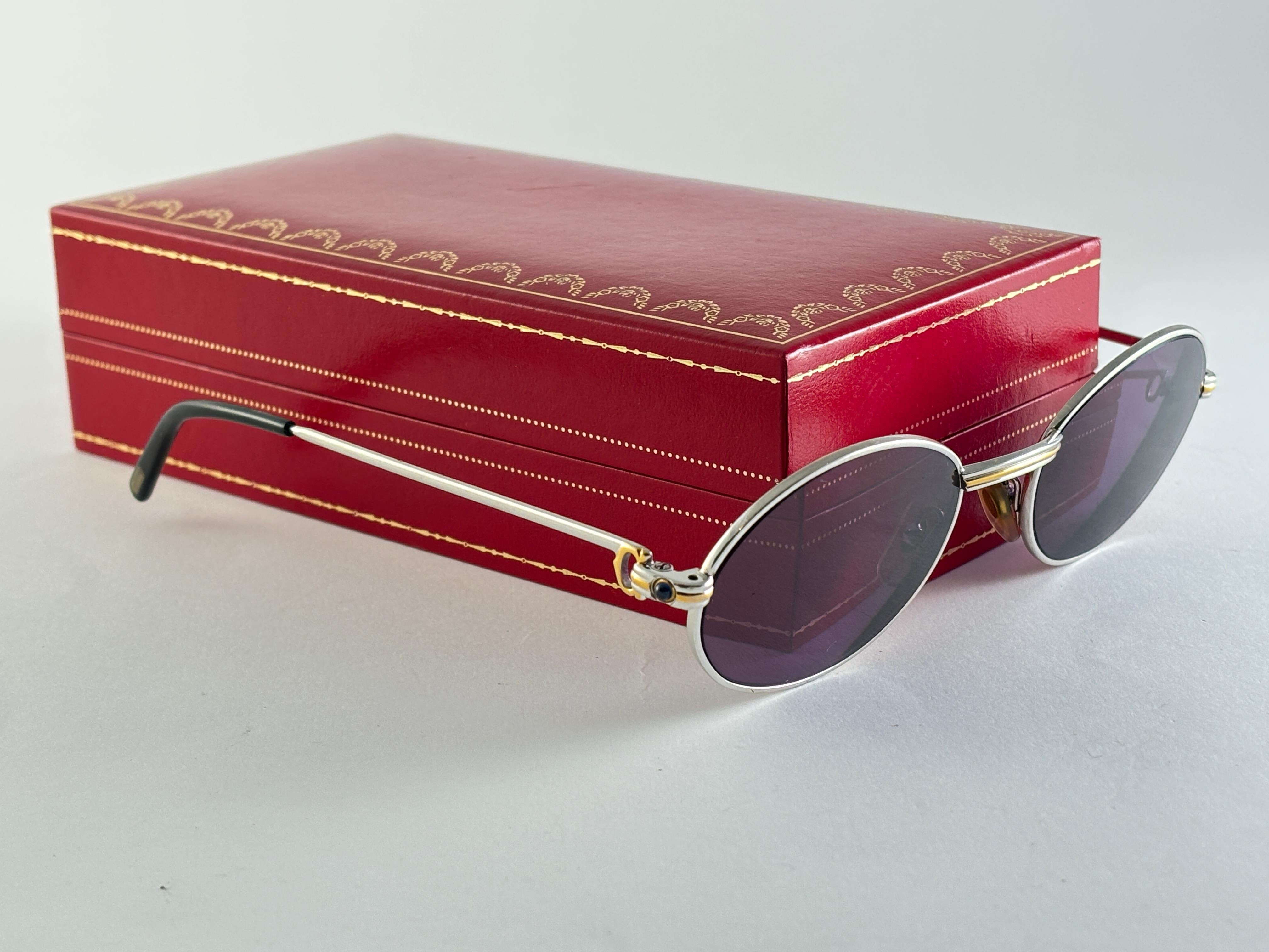 Cartier Oval St Honore Limited Series Sunglasses Adorned With Two Sapphire Gemstones On Each Side.
All Hallmarks. Cartier Signs On The Ear Paddles. 
Both Arms Sport The Knot From Cartier On The Temple. These Are Like A Pair Of Jewels On Your Nose.