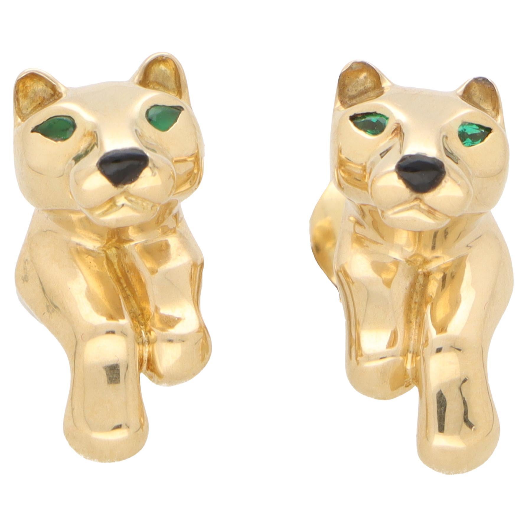 A beautiful pair of vintage Cartier panther earrings set in 18k yellow gold.

Each earring depicts the iconic Cartier motif, the panther, and are made of solid yellow gold. They are designed to perch on the wearers ear with the paws clutching the