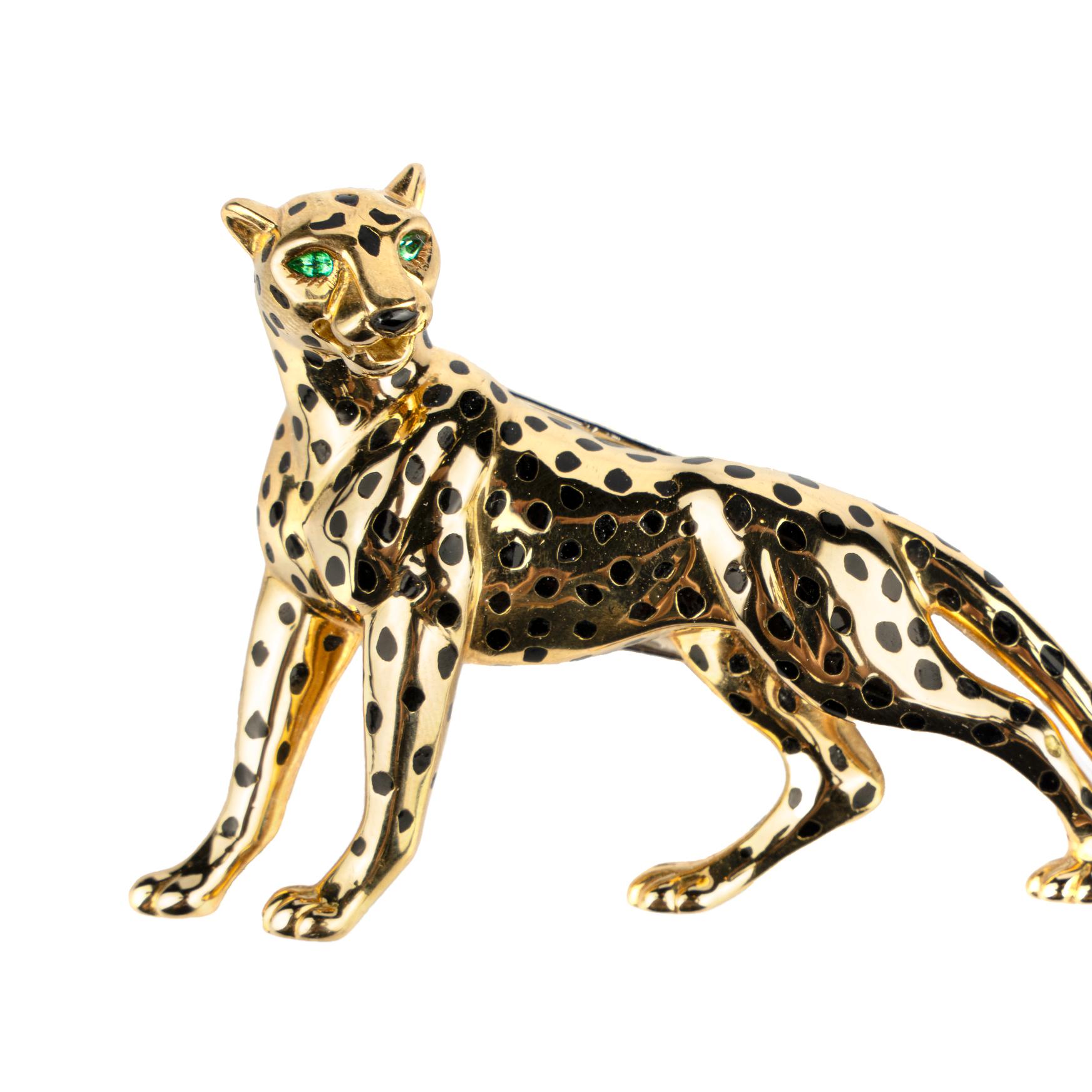 Collectible Cartier Panthère Brooch in 18k gold with black enamel spots and emerald eyes. Made in Paris, circa 1980.