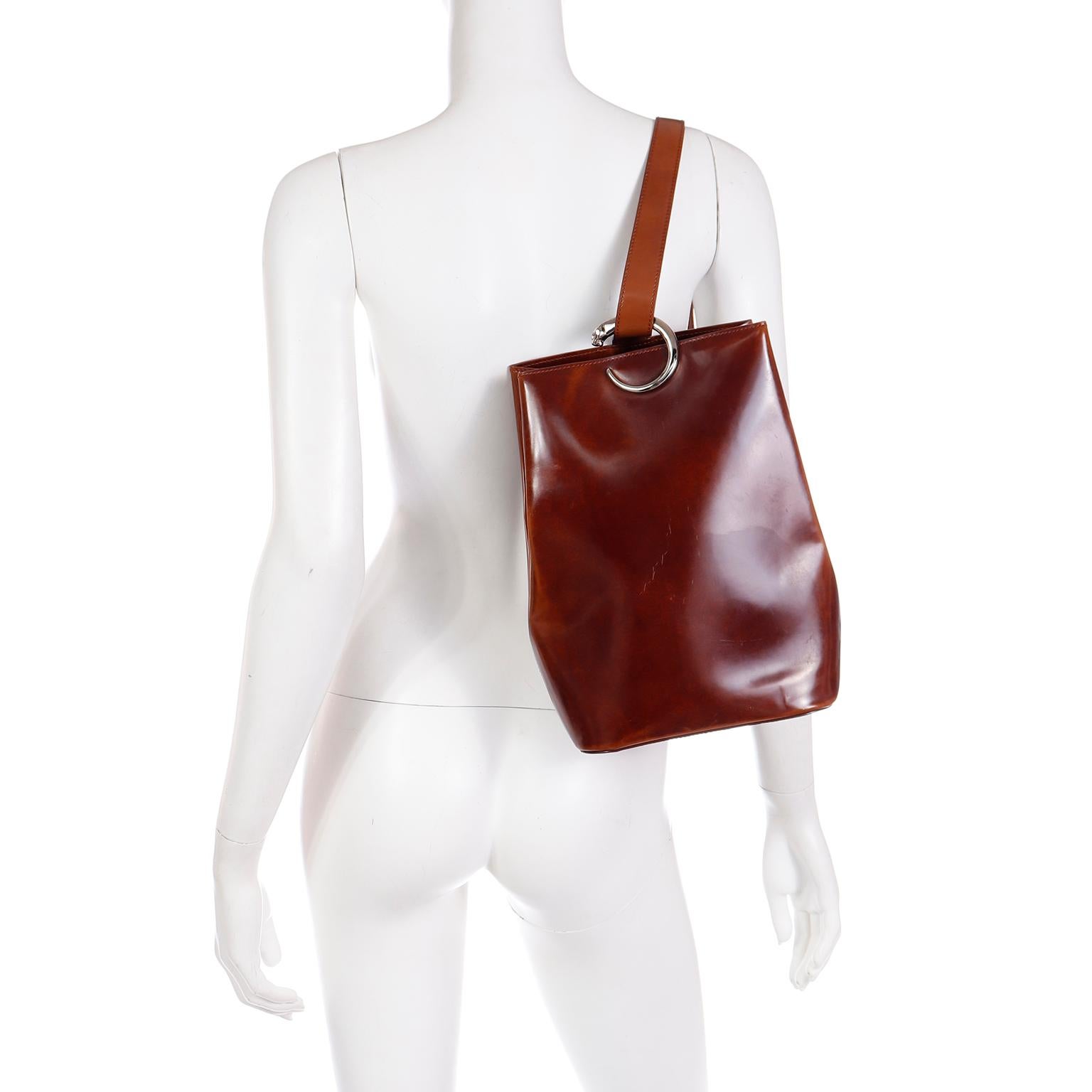 This gorgeous Cartier Panthere vintage 1990's brown leather shoulder bag can be worn as a side or back sling bag. We love bags like these because they can hold a lot and have so much understated elegance. The inside is lined in a leopard print and
