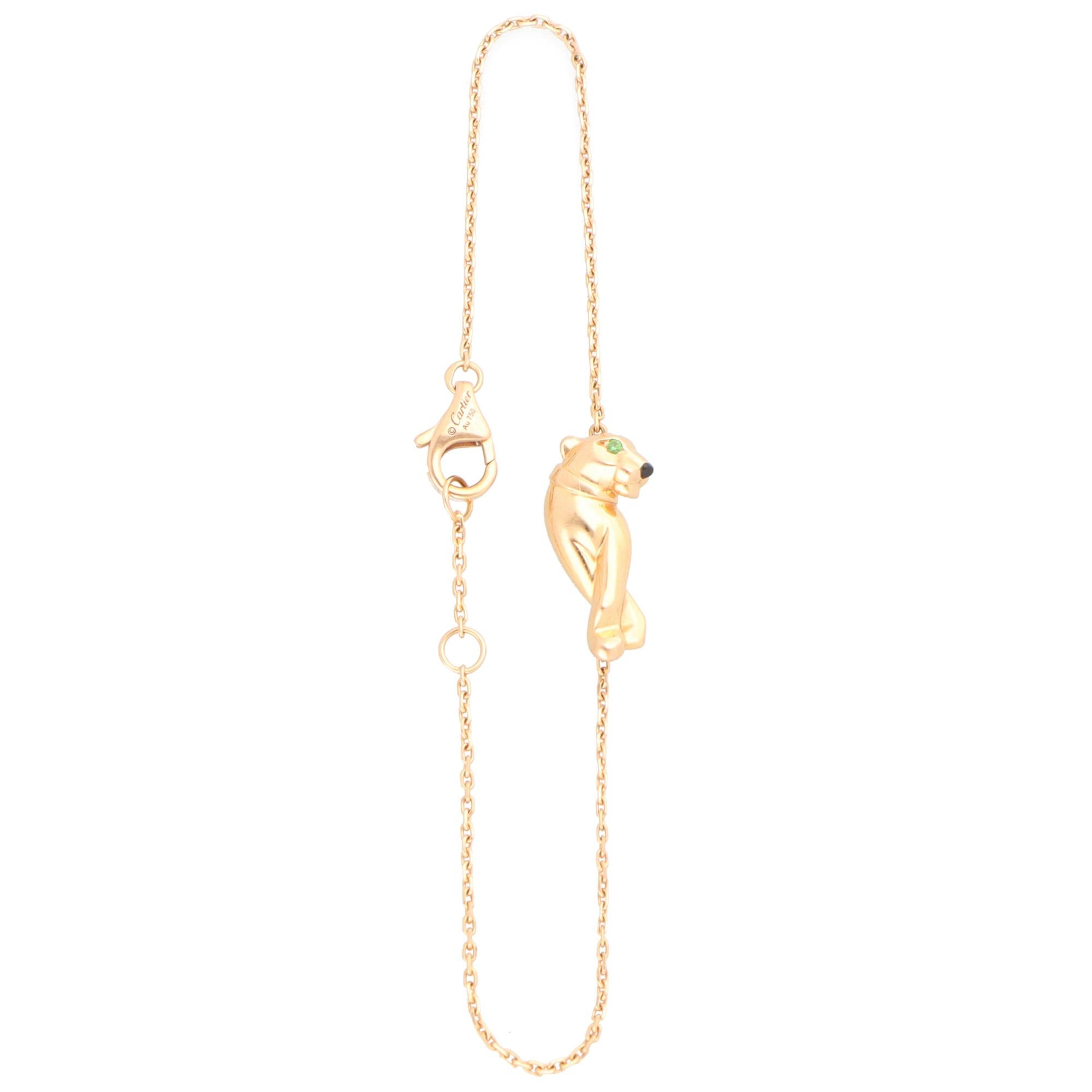 A beautiful vintage Cartier ‘Panthère de Cartier’ bracelet set in 18k rose gold.

This piece features Cartier’s iconic panther motif, crafted from solid 18k rose gold. The panther is adorned with two faceted tsavorite garnet eyes and a black lacquer
