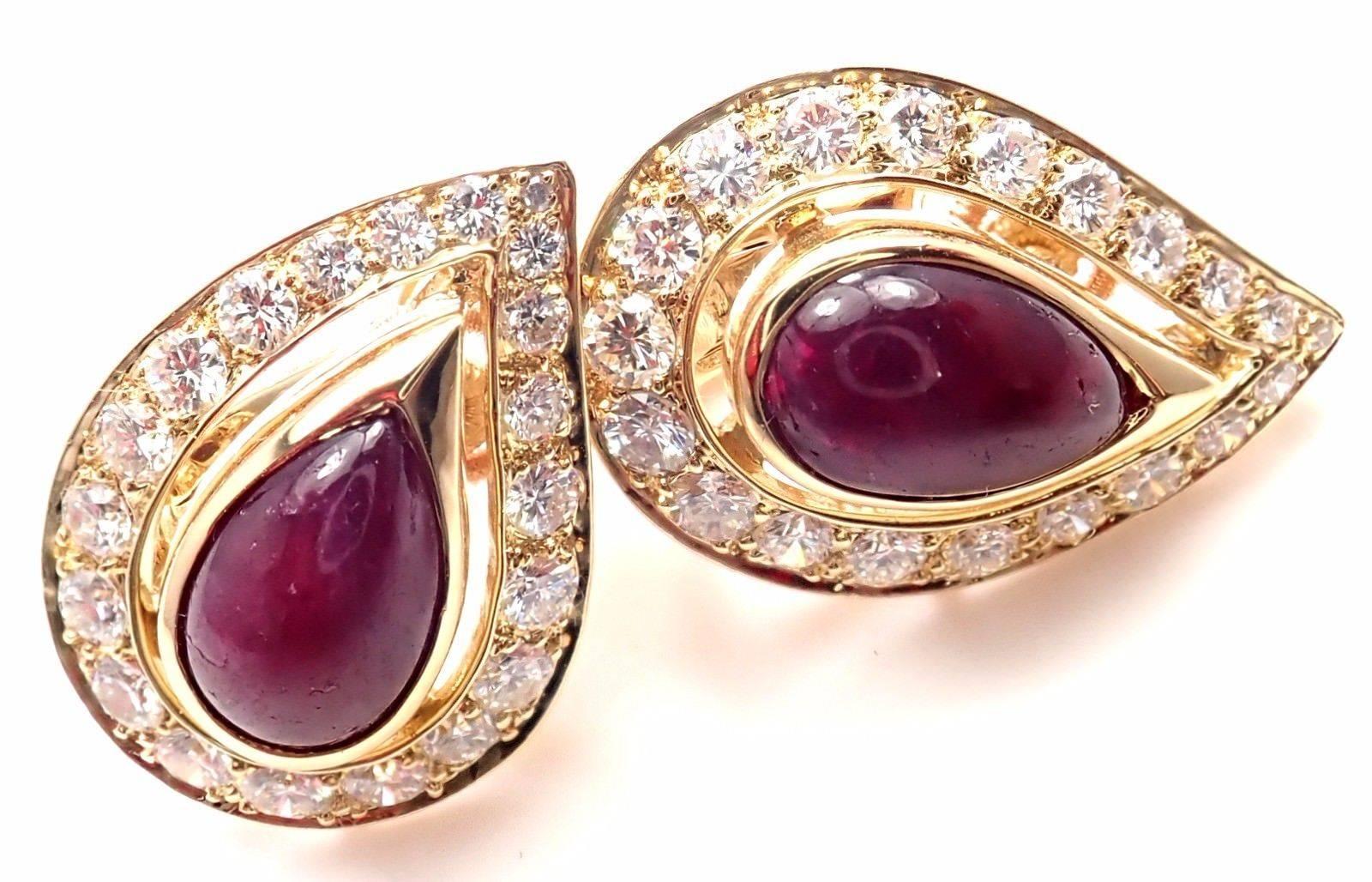 18k Yellow Gold Diamond And Ruby Vintage Earrings by Cartier. 
With 20 round brilliant cut diamonds VVS1 clarity, E color total weight approx. 1ct
2 pear shape cabochon rubies 10mm x 7mm each
***These earrings are made for pierced ears.***
Details: