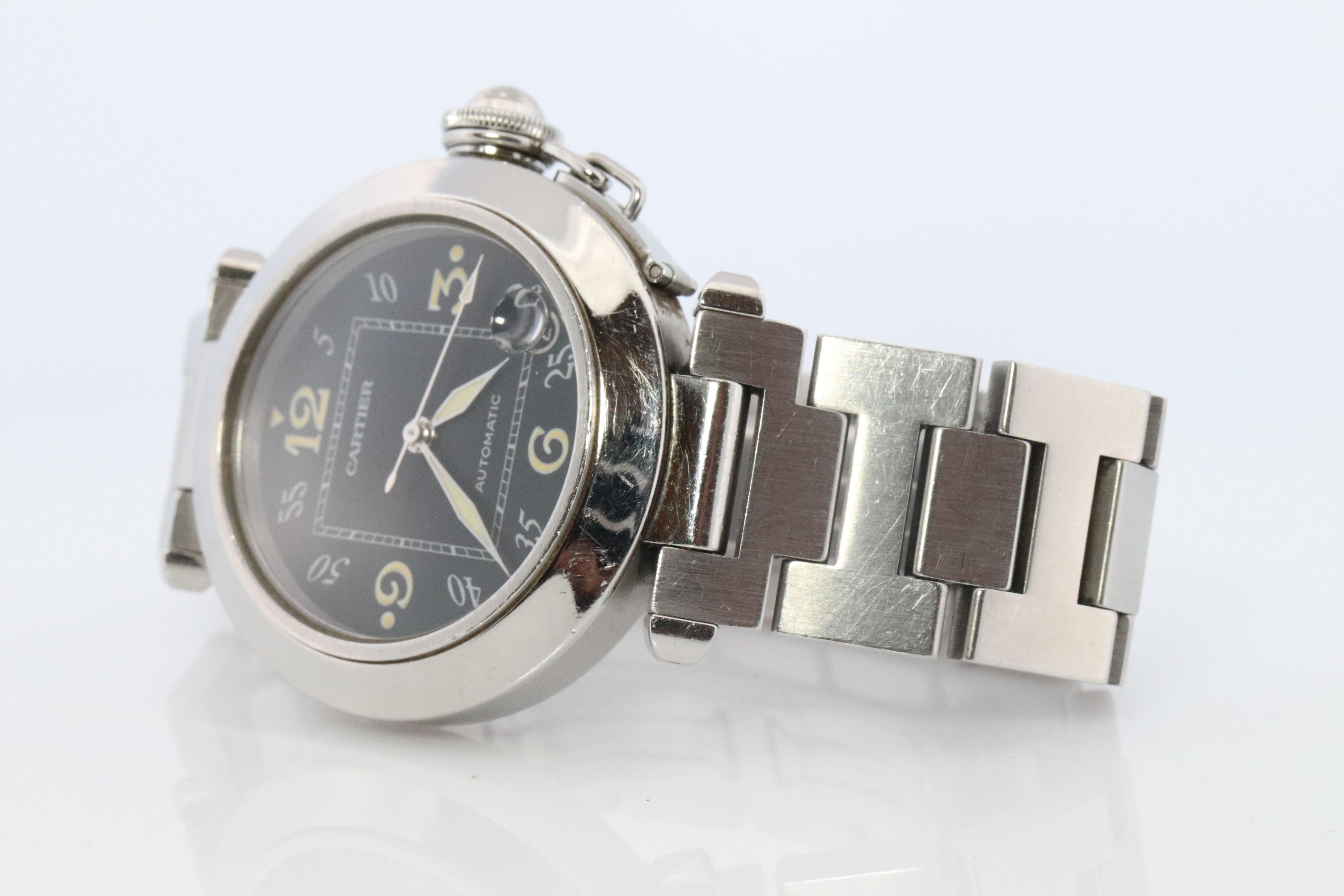 Genuine Cartier watch.

Cartier Pasha C
ref. 2324

W31043M7

Rare Black Dial.
35mm Case.

Automatic Movement.

Condition: Original Paperwork with Original Box.

Please ask for more details, photos or videos.