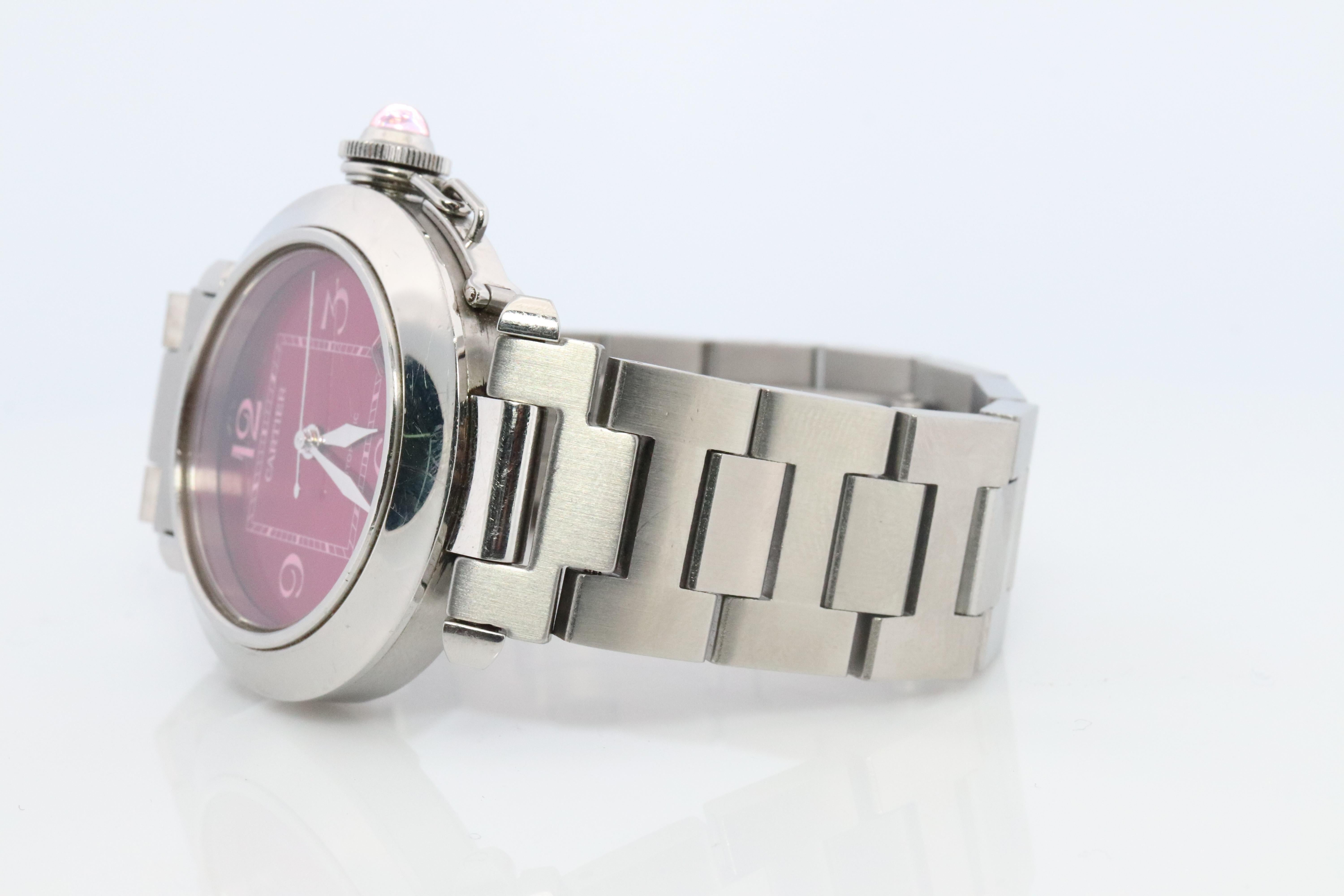 Genuine Cartier watch.

Cartier Pasha C
ref. 2324

W3108299

Rare Red Burgundy Dial.
35mm Case.

Automatic Movement.

Condition: Has a smaller scratch on Crystal

Details:
Generic Stainless Steel Bracelet.


Please ask for more details, photos or