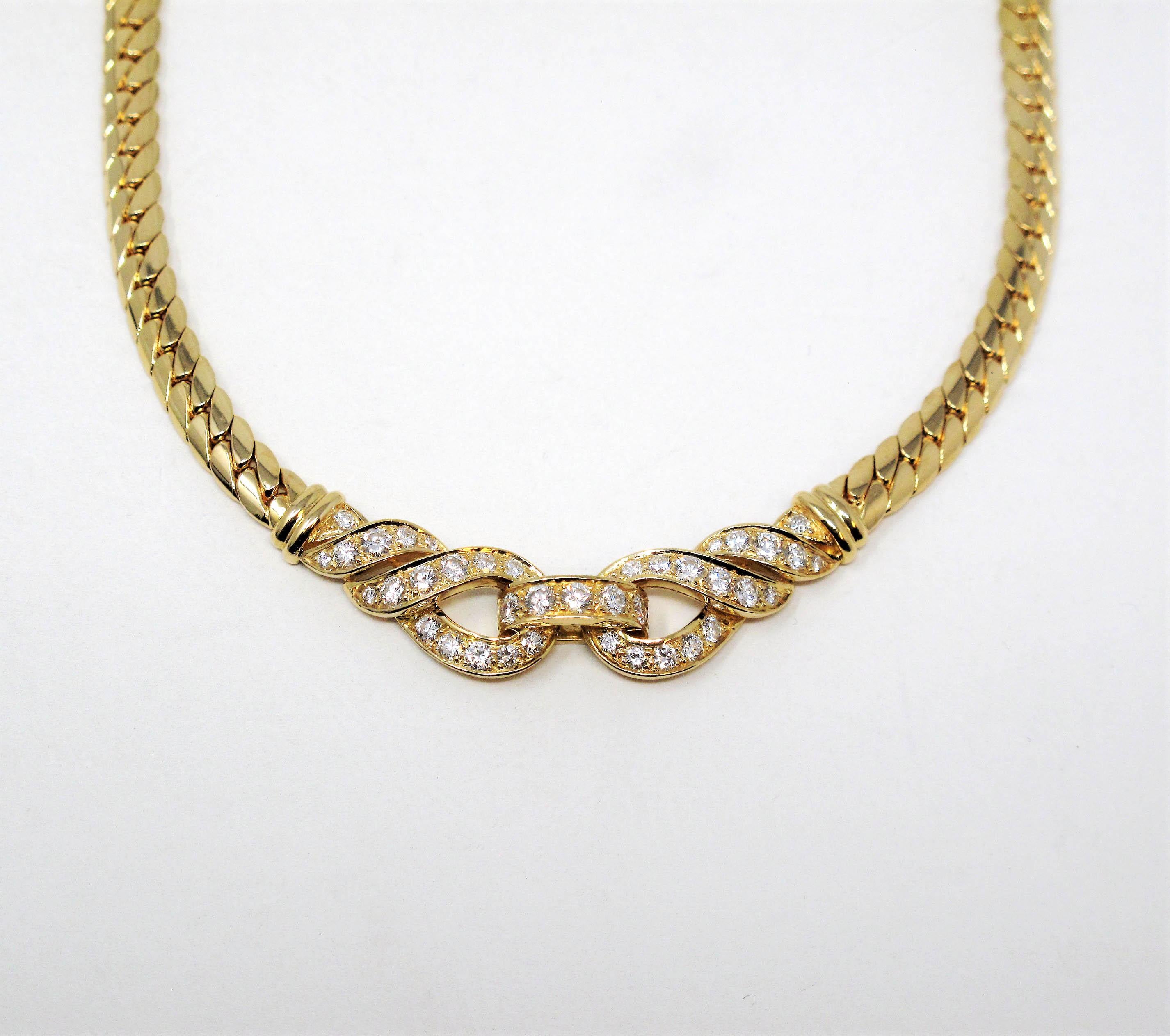 Cartier wows us once again with this gorgeous pave diamond collar necklace. Stunningly simple in design, the curved lines and glittering diamonds make the piece absolutely shine!

This beautiful designer necklace features a solid 18 karat yellow