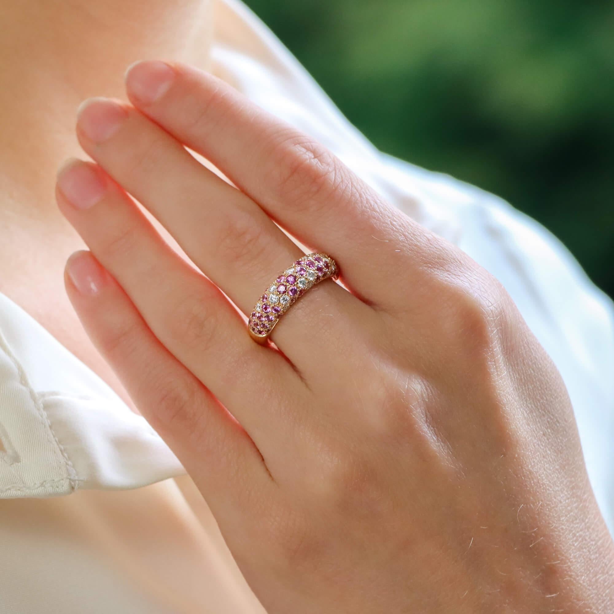 An extremely striking vintage Cartier diamond and pink sapphire bombé ring from the sought after ‘Mimi’ collection, set in 18k rose gold.

From the now discontinued Mimi collection, this beautiful piece predominantly features a marvellous display of