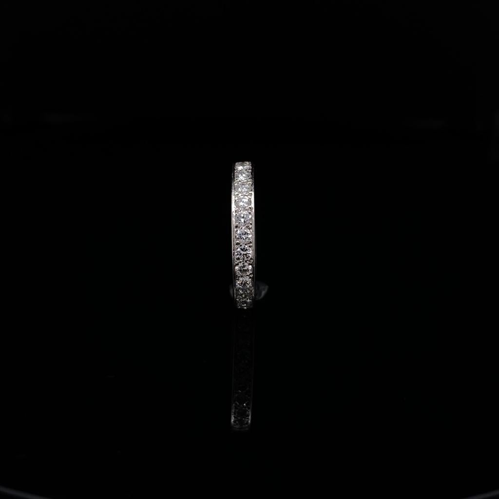 A vintage Cartier platinum diamond full eternity ring, circa 1950.

A beautiful full eternity band, grain set with a single row of round brilliant cut stones of 1.36 carats approximately estimated by ourselves as G-H colour, VS1 clarity.

The
