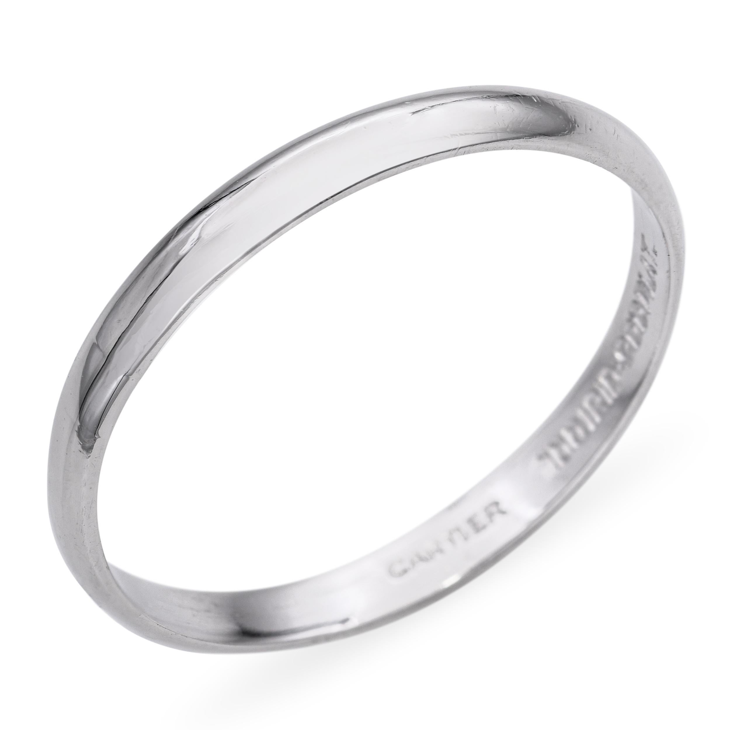 This timeless vintage band ring is crafted in luxurious platinum by Cartier, renowned for its exceptional craftsmanship. The sleek, minimalist design highlights the metal’s natural luster and durability. Versatile and elegant, it can be worn as a