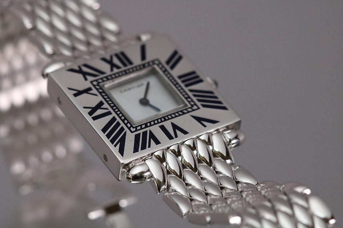Cartier Quadrant square 18k white gold case on a white gold bracelet with enamel numerals.
This has the Piaget movement and is on a white gold Cartier bracelet with fold over deployant clasp.