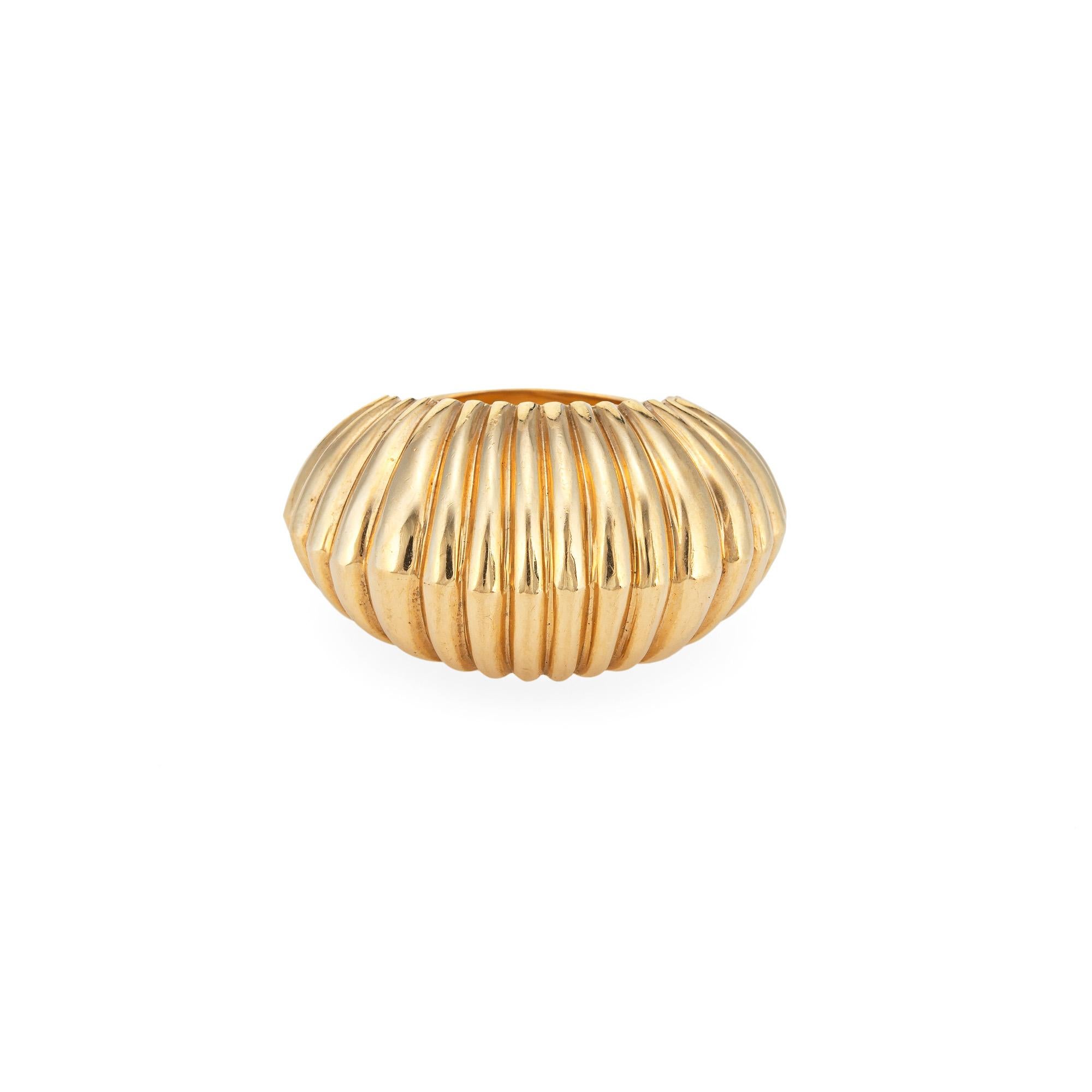 Finely detailed vintage Cartier bombe cocktail ring (circa 1945) crafted in 14 karat yellow gold. 

The stylish vintage ring features a fluted high dome in a textured shell motif. The whimsical design of the ring highlights the bold aesthetic of the