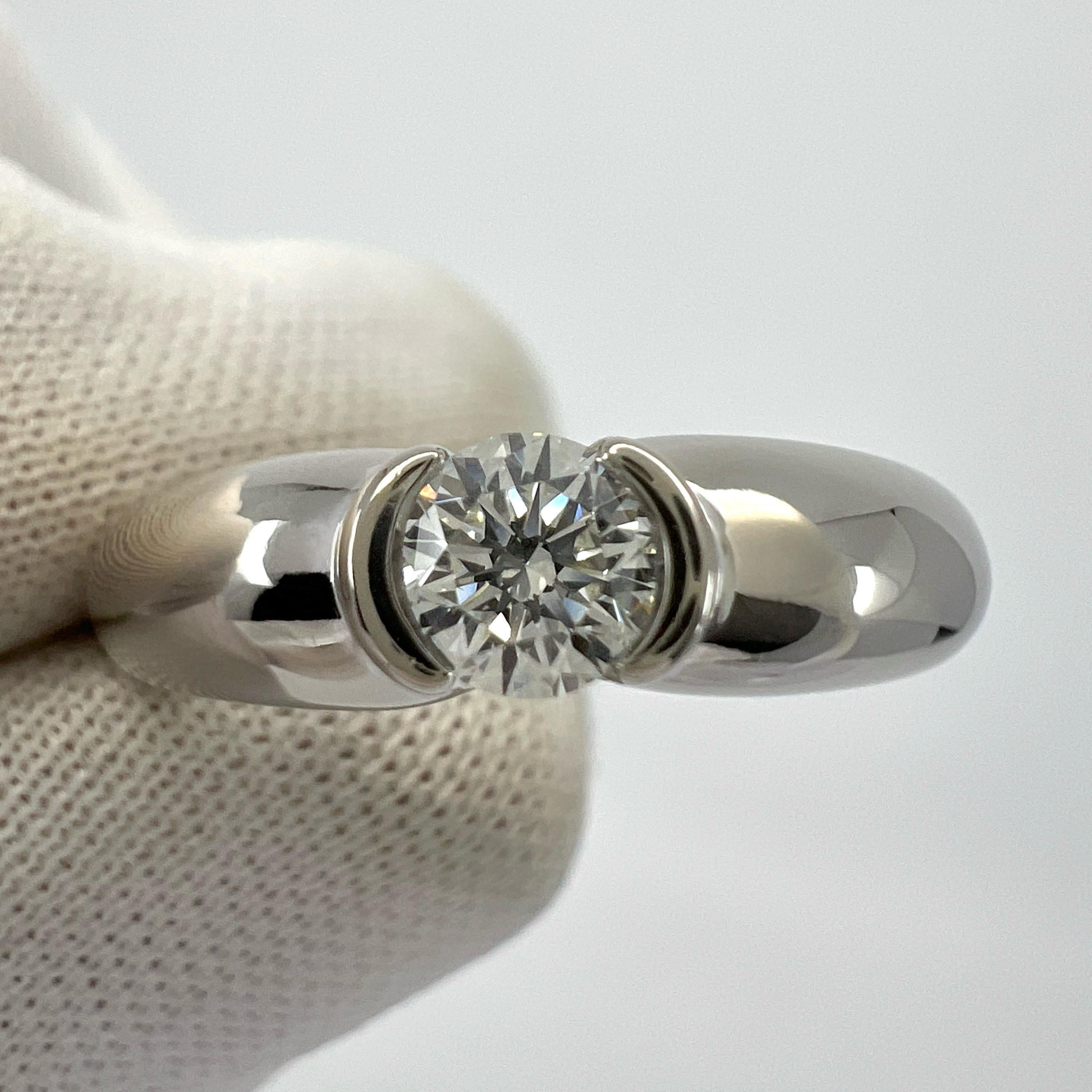 Vintage Cartier Round Brilliant Diamond 18k White Gold Solitaire Ring.

Beautiful white gold ring set with a fine 0.28ct round cut natural diamond. The diamond has very white E/F colour and VVS1/2 clarity with an excellent round brilliant cut. Looks
