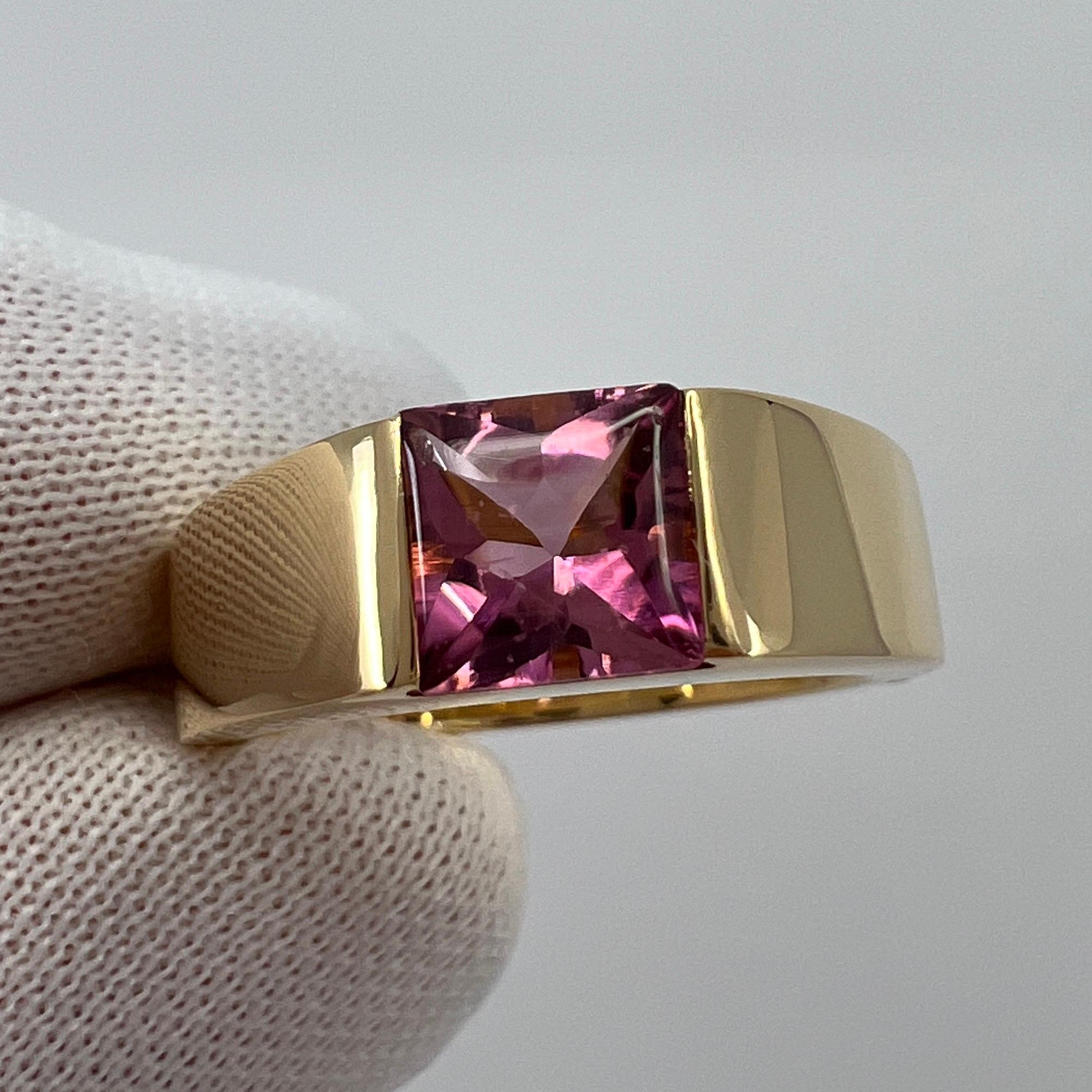 Vintage Cartier Pink Rubellite Tourmaline 18 Karat Yellow Gold Tank Ring.

Stunning yellow gold ring with a 5.8mm tension set deep pink purple fancy-cut tourmaline. Fine jewellery houses like Cartier only use the finest of gemstones and this