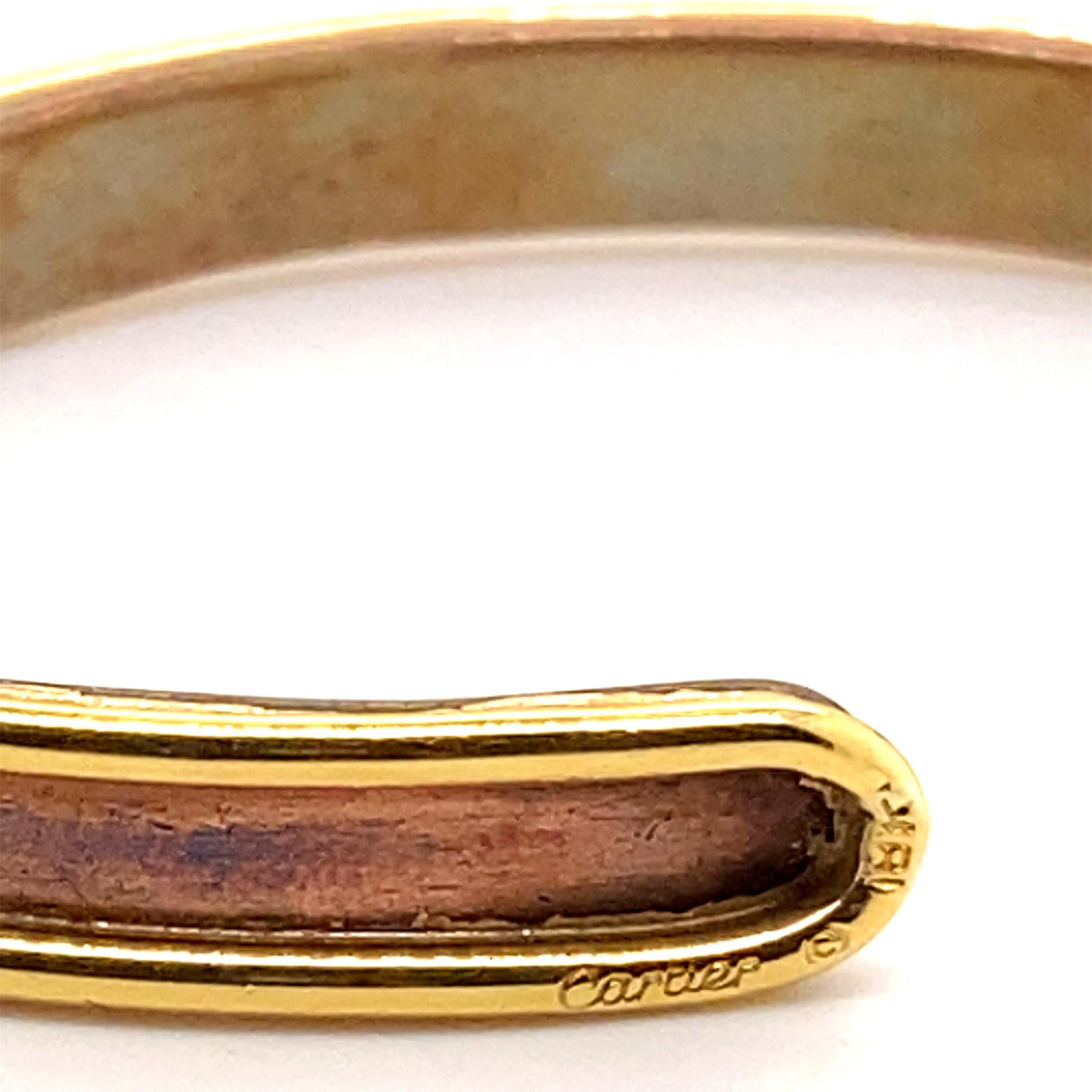 A vintage Cartier Sabona cuff bracelet in 18 karat yellow gold & copper, circa 1970.

Sabona was established in 1959 in New York, and in 1970, the design, a collaboration with Cartier
New York, was released. This model was sold out as soon as it was