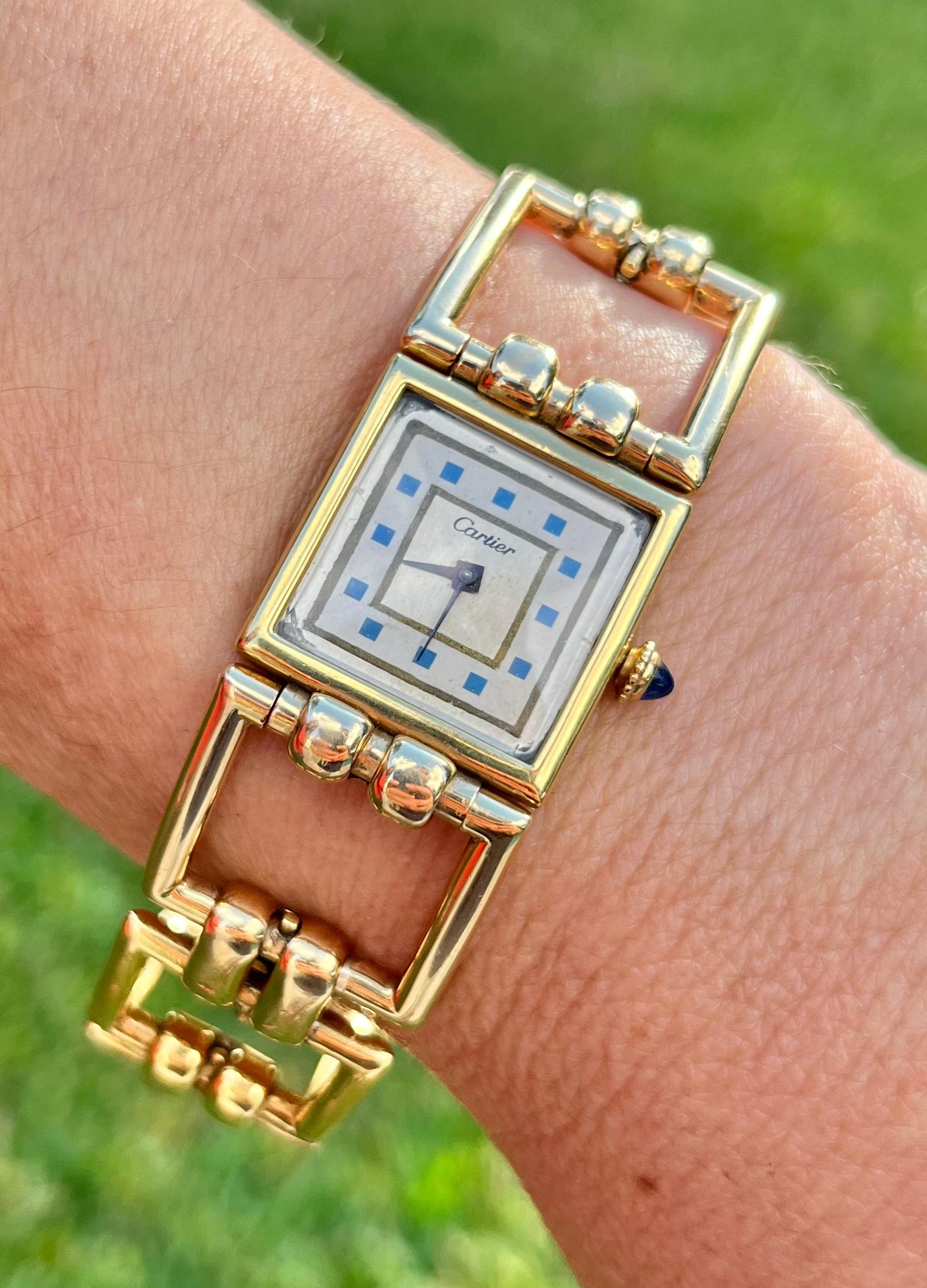 Cartier signed original ladies wristwatch. Vintage, circa 1960. This timepiece has a unique 14k gold square link bracelet that seamlessly wraps around the wrist. The movement is still in perfect working condition (manual wind). It's a gorgeous art