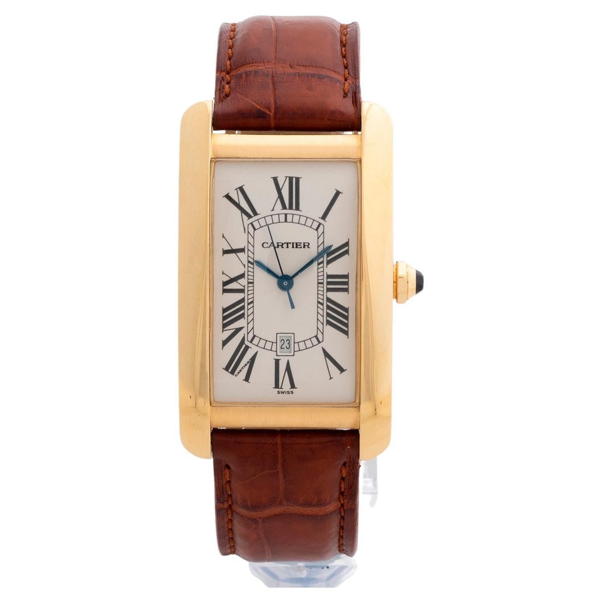 Our rare and near vintage Cartier Tank Americaine with automatic movement, reference 1740, is the XL version with 26mm x 44mm tank case in 18k yellow gold with white dial and its original tan leather strap with 18k yellow gold Cartier tang buckle.