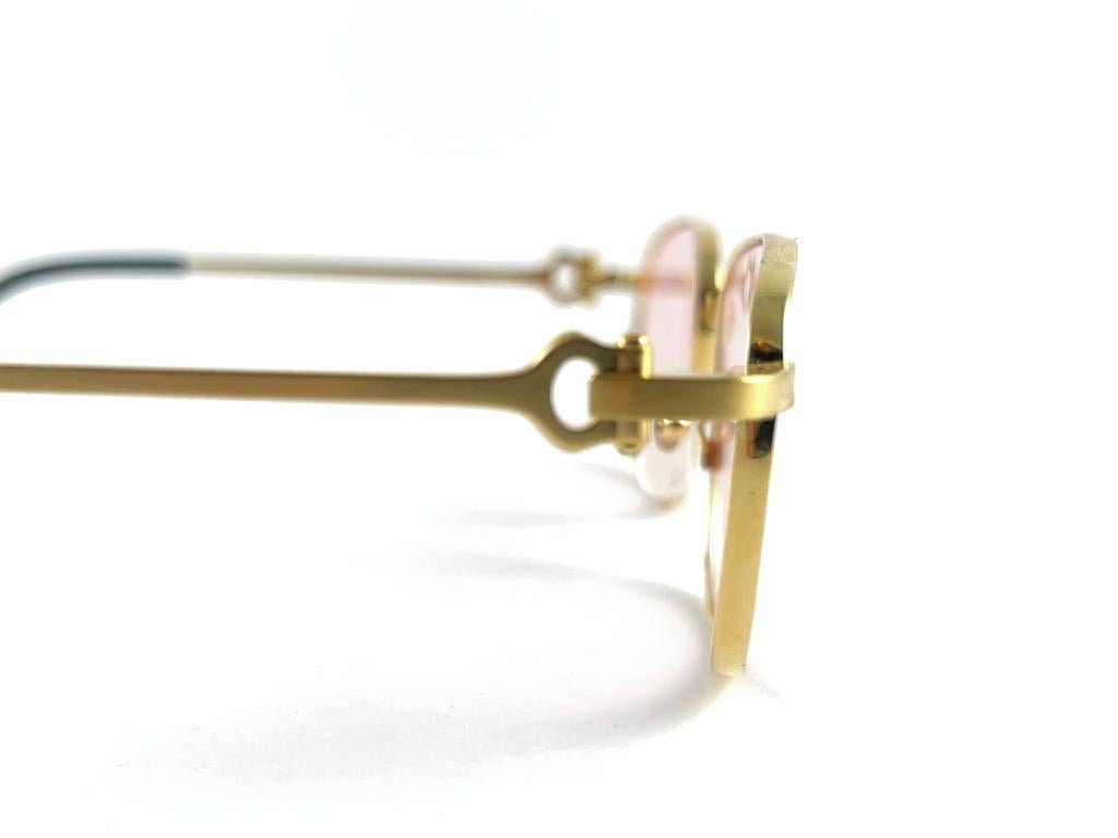 Vintage Cartier Temper brushed gold with light peach  (uv protection) lenses. 
 All hallmarks. Cartier signs on the earpaddles. These are like a pair of jewels on your nose with the 18k gold frame and white gold accents. Beautiful design and a real