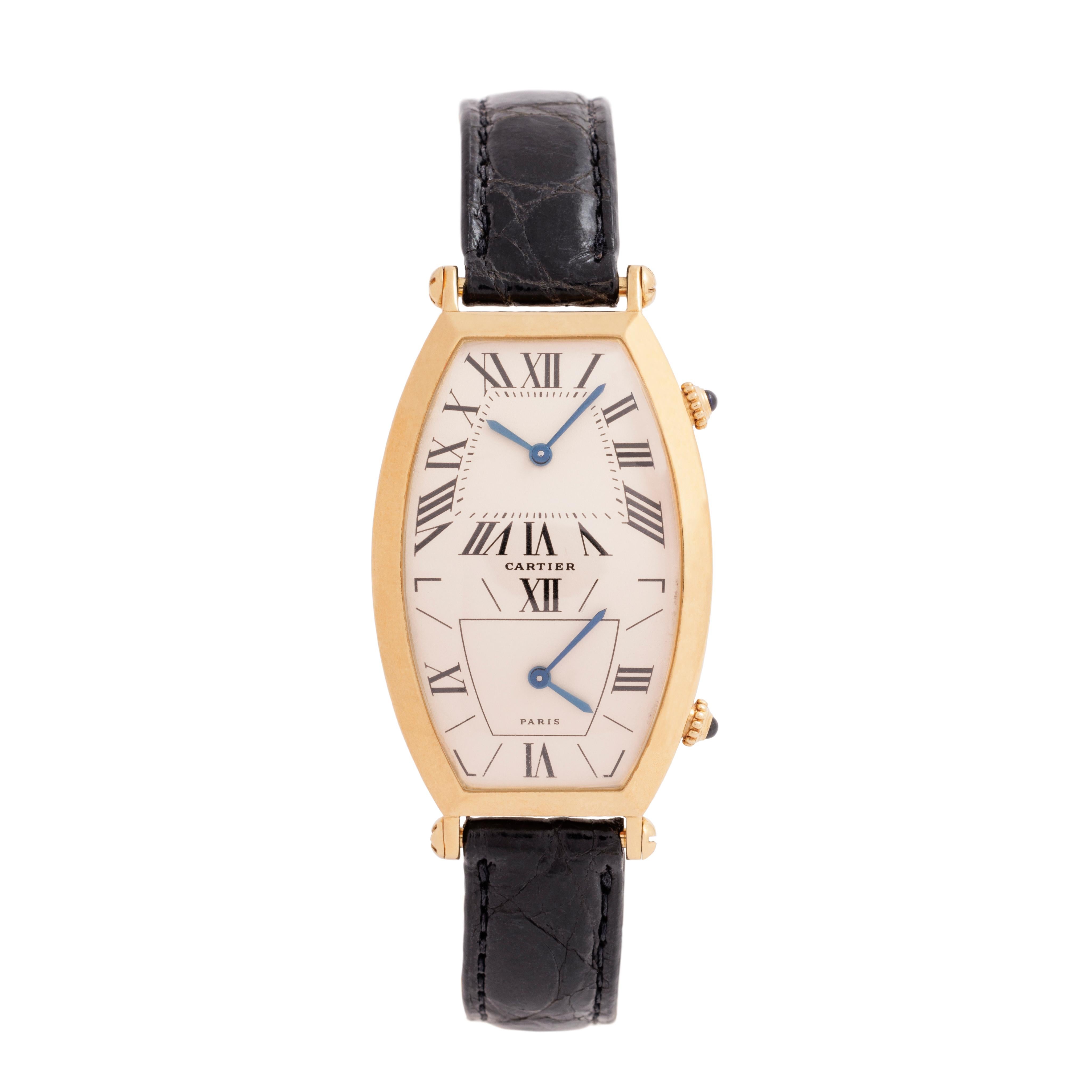 Vintage Cartier Tonneau Dual-Time 18k Yellow Gold Large Size On Cartier Black Alligator Strap and 18k Yellow Gold Deployment Buckle
46mm x 26mm
Model # W1502853
Quartz Movement
c.1990s

Crafted with precision and practicality, the Cartier Tonneau
