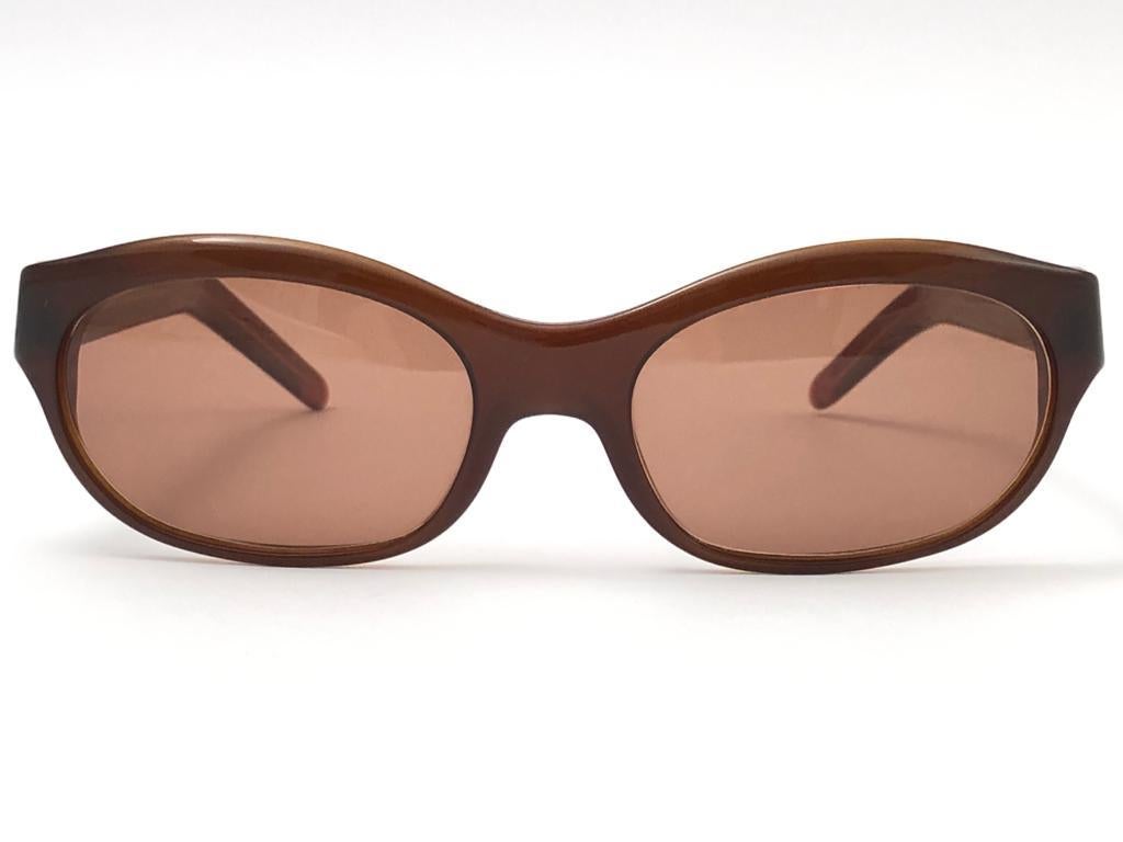 New Cartier in brown with brown  (uv protection) lenses. 
Frame is black and has the famous real gold accents. All hallmarks. 
These are like a pair of jewels on your nose with the 18k heavy gold plated accents. 
Beautiful design and a real sign of