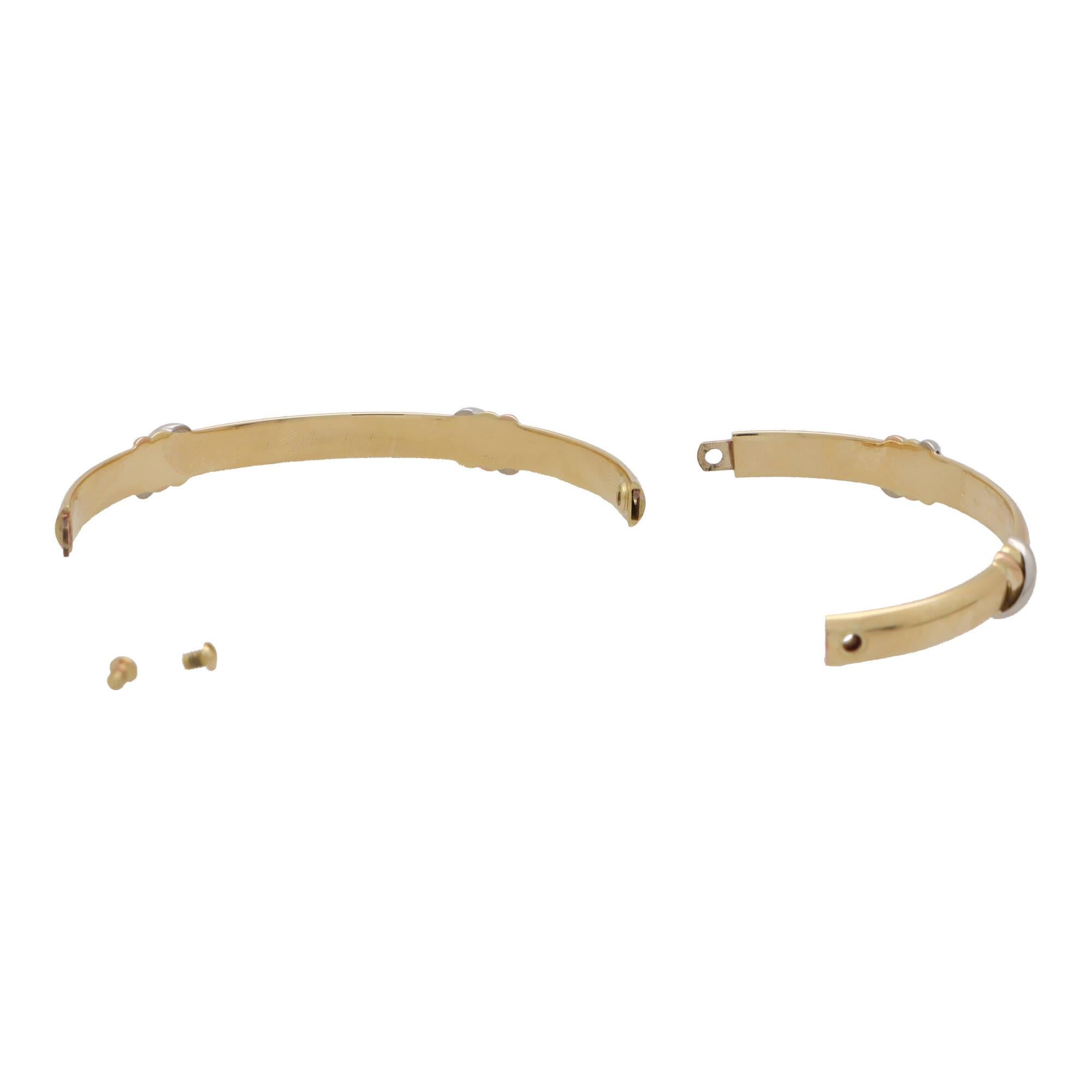 Vintage Cartier 'Trinity Kiss' Screw Bangle Set in 18k Yellow, Rose & White Gold In Excellent Condition In London, GB