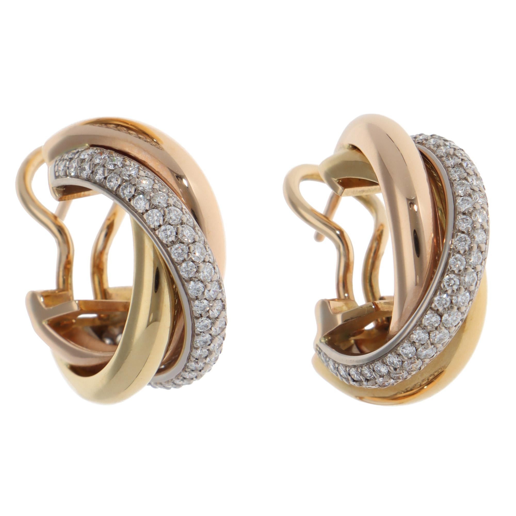 A beautiful pair of vintage Cartier Trinity semi-paved diamond hoop earrings set in 18k yellow, rose and white gold from 2012.

Each earring is set in the iconic Trinity design and is composed of three 3.5-millimetre bands, which are soldered