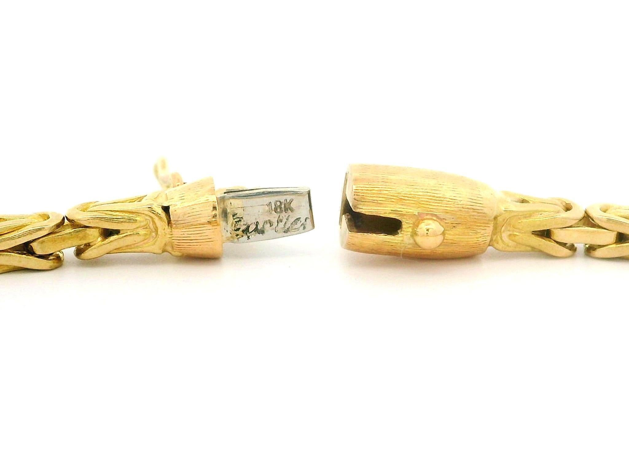Material: Solid 18k Yellow Gold
Weight: 14.77 Grams
Length: Measures 7.5 Next to a Ruler. Will comfortably fit up to a 7 inch wrist (fitted on a wrist)
Chain Type: 2.8mm Byzantine Link
Clasp: Barrel Push Clasp w/ Safety Latch
Centerpiece Dimensions: