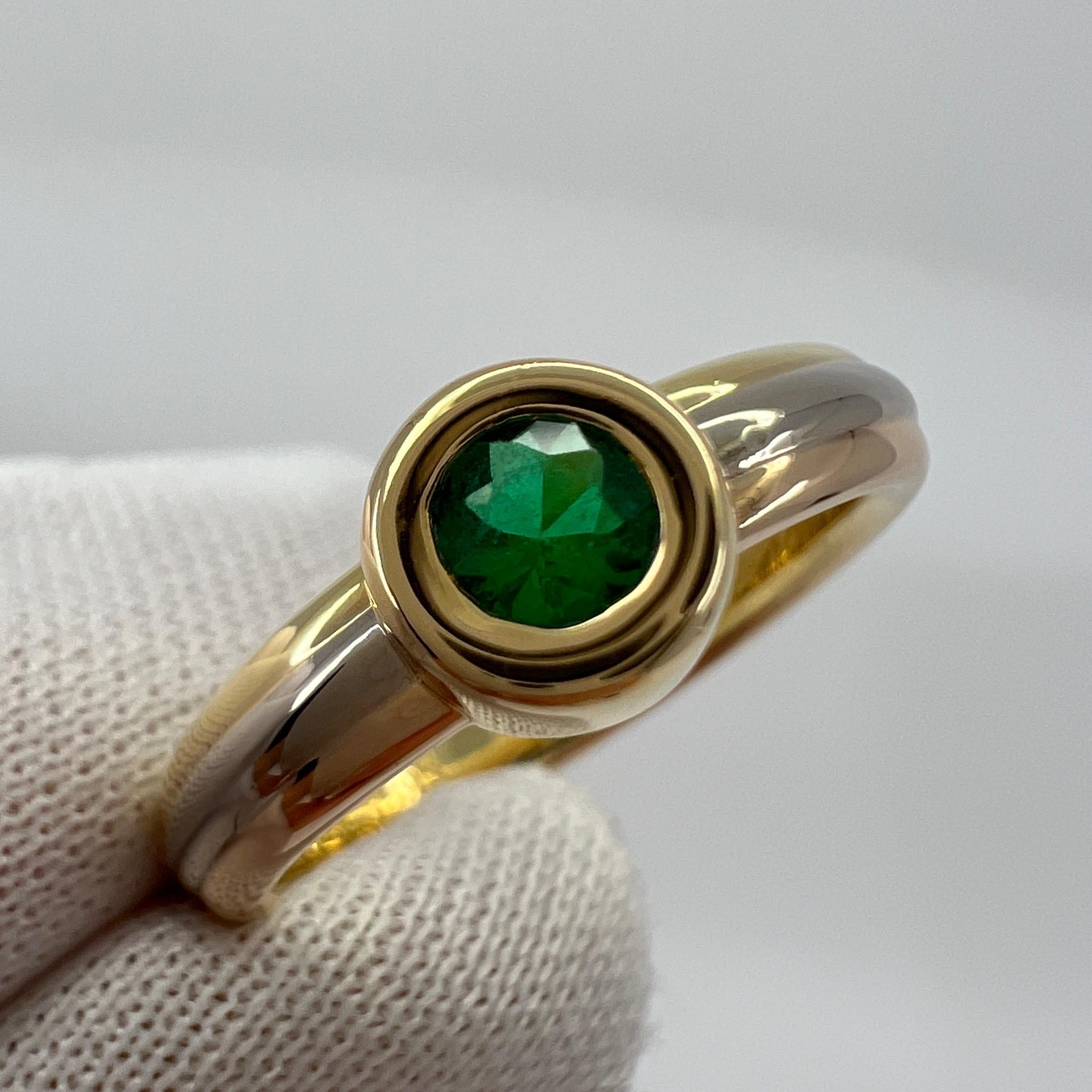 Vintage Cartier Round Cut Emerald 18k Tri Colour/Multi Tone Gold Solitaire Ring.

Stunning multi tone gold ring set with a fine vivid green emerald. Jewellery houses like Cartier only use the finest of gemstones and this emerald is no exception. A