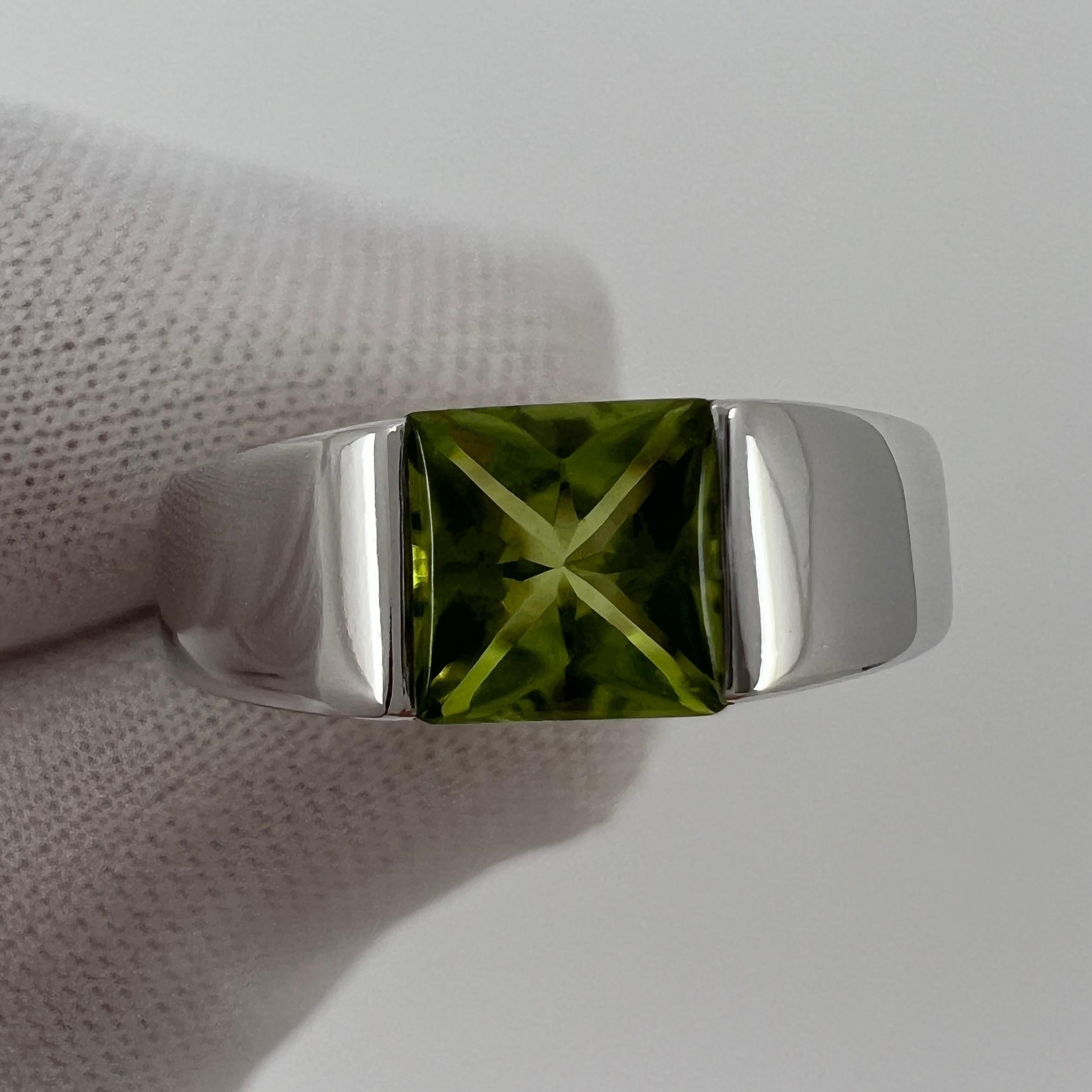 Vintage Cartier Vivid Green Peridot 18 Karat White Gold Tank Ring.

Stunning white gold ring with a 6mm tension set vivid green peridot. 
Fine jewellery houses like Cartier only use the finest of gemstones and this peridot is no exception. A top