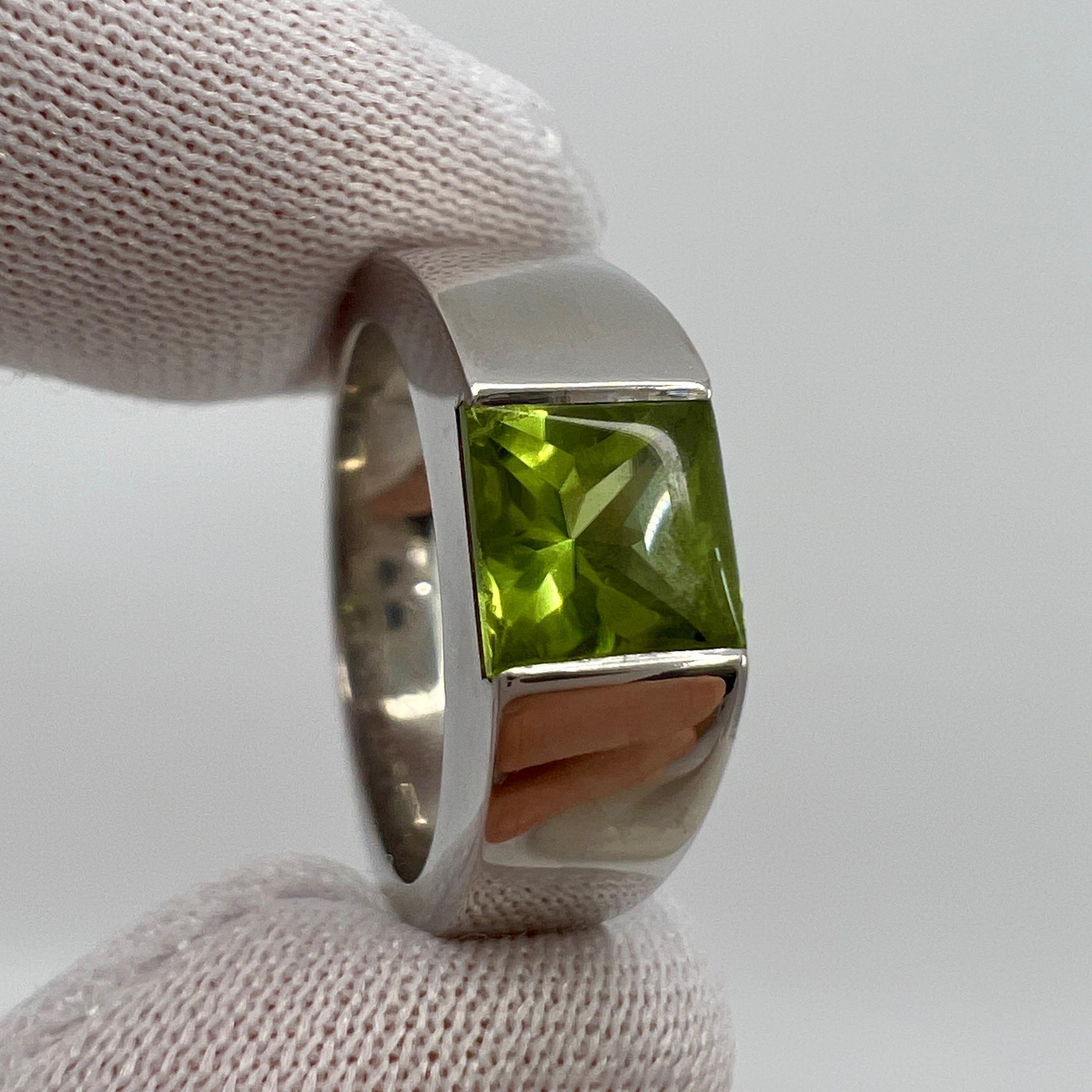 Vintage Vivid Green Peridot 18 Karat White Gold Tank Ring.

Stunning white gold ring with a 6mm tension set vivid green peridot. Fine jewellery houses like Cartier only use the finest of gemstones and this peridot is no exception. A top grade