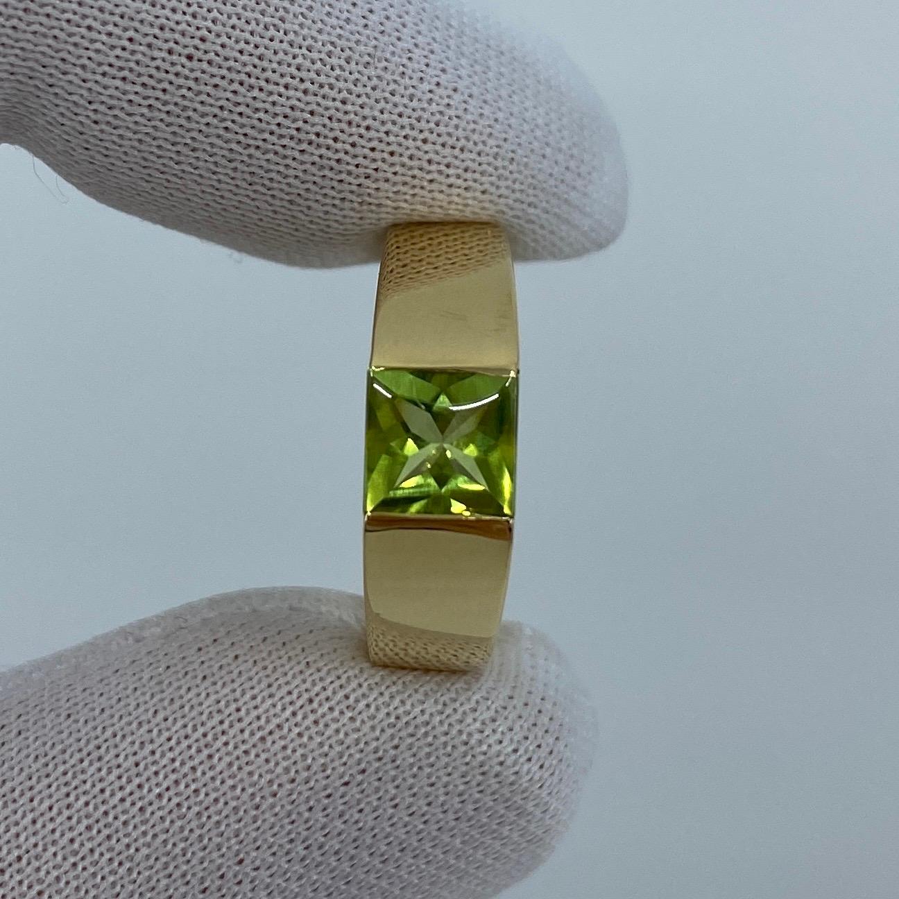Cartier Green Peridot 18k Yellow Gold Tank Ring.

Stunning yellow gold ring with a 6mm tension set vivid green peridot. Fine jewellery houses like Cartier only use the finest of gemstones and this peridotis no exception. A top grade peridot with a