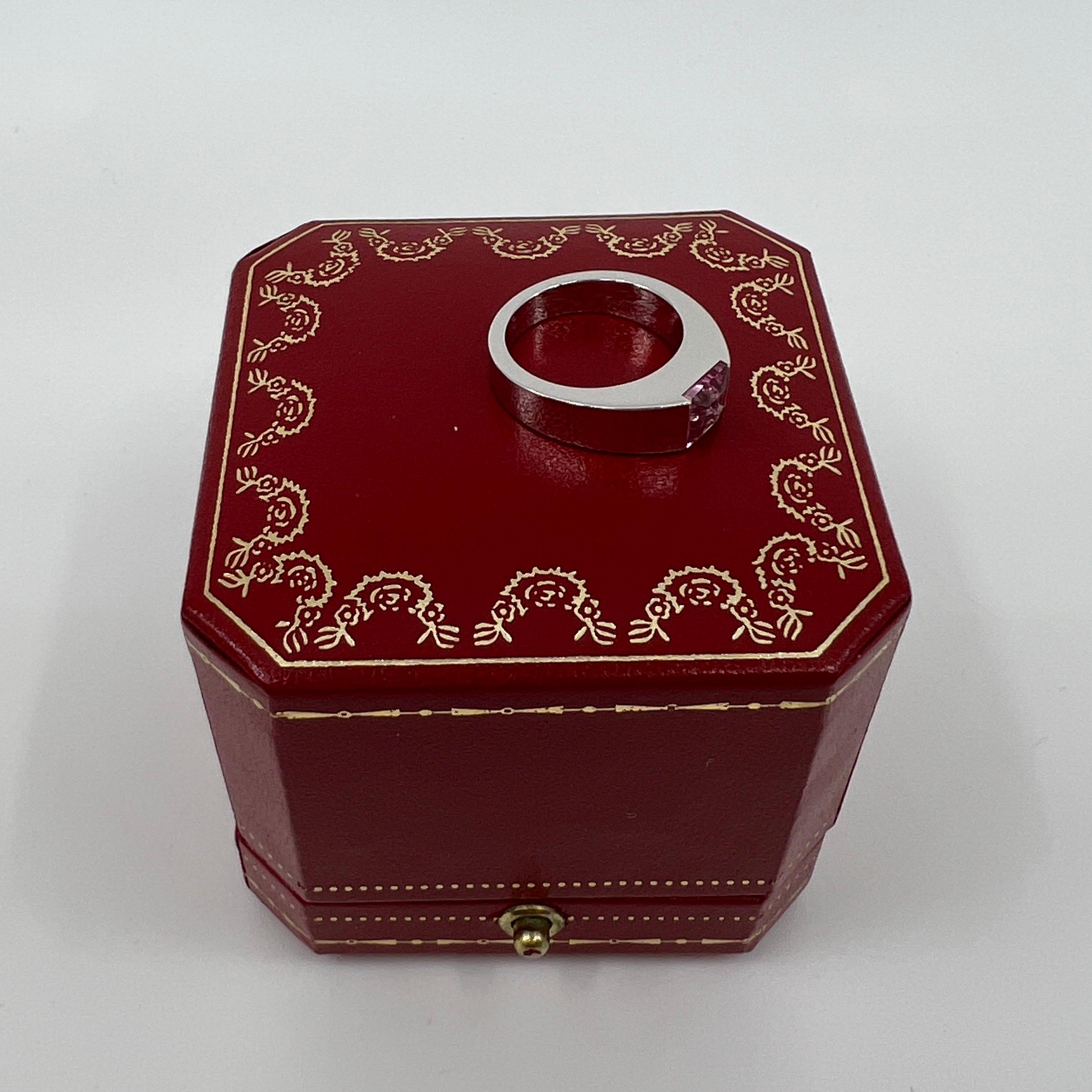 Vintage Cartier Vivid Pink Tourmaline 18 Karat White Gold Tank Ring.

Stunning white gold ring with a 6mm tension set bright pink fancy-cut tourmaline. Fine jewellery houses like Cartier only use the finest of gemstones and this tourmaline is no