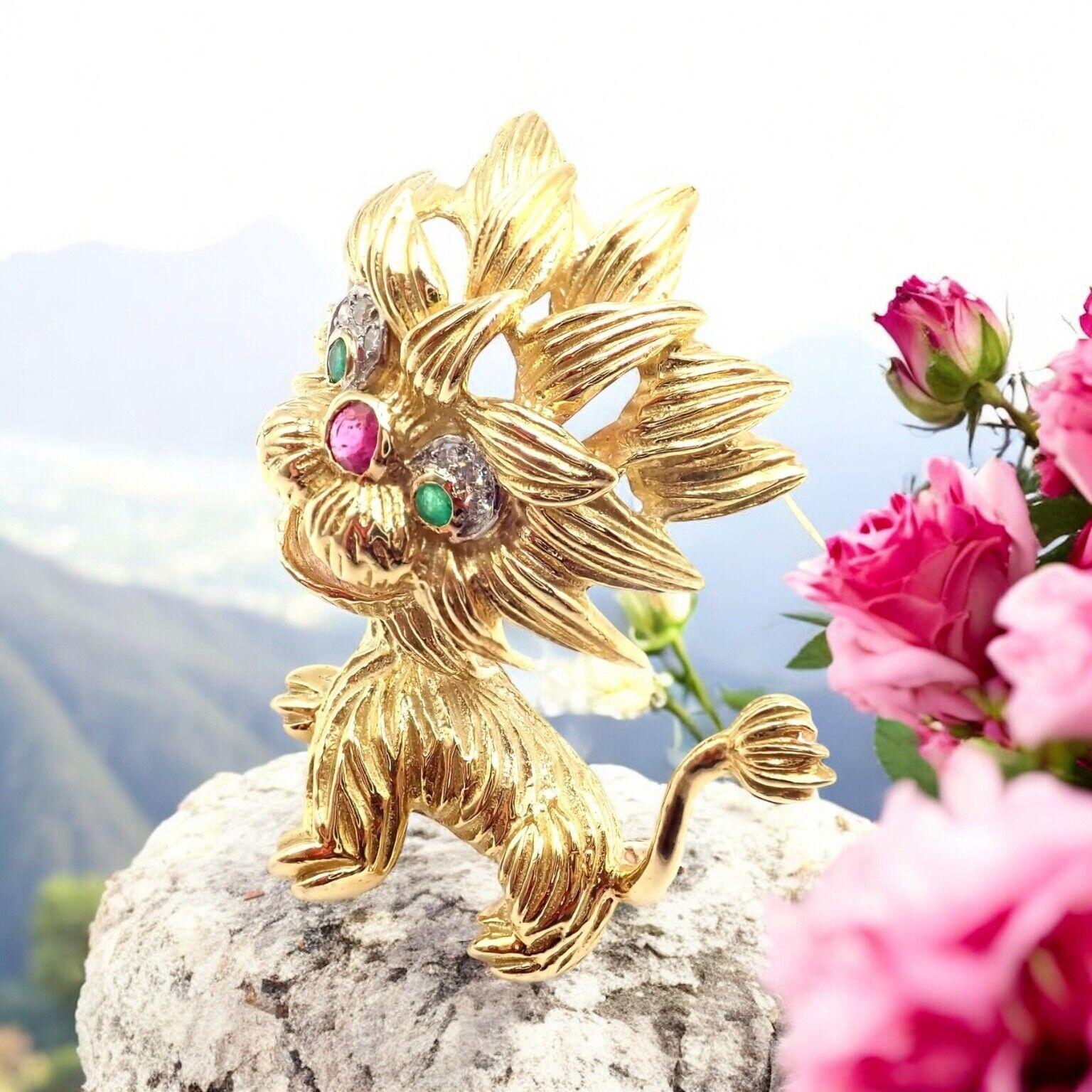 18k Yellow Gold Diamond Ruby Emerald Vintage Lion Dragon Pin Brooch by Cartier. 
A truly whimsical creation, this Cartier dragon-lion brooch combines mythical charm with luxurious craftsmanship. 
Fashioned in 18k yellow gold, it boasts brilliant