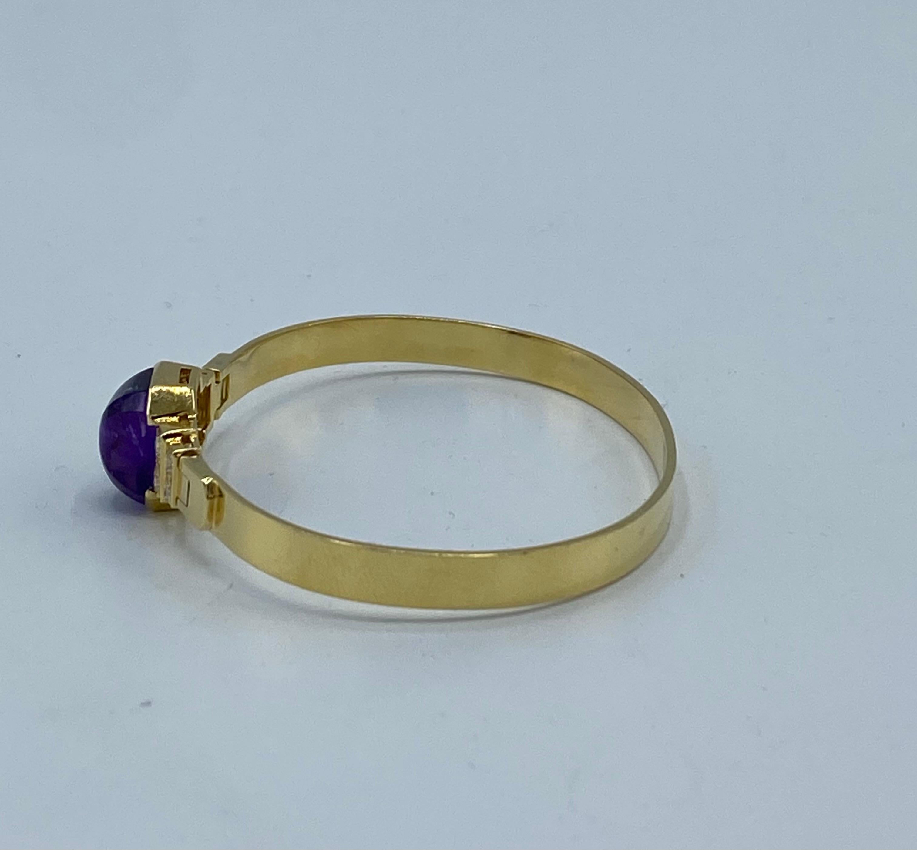 Product details:

The bangle features 18 karat yellow gold with 0.58 cts of sugarloaf amethyst and 0.60 cts of round brilliant cut diamonds, F/ VS1.
It is signed by Cartier, stamped with 18K and numbered 000275.
Total weight is 14.6 grams.
The inner