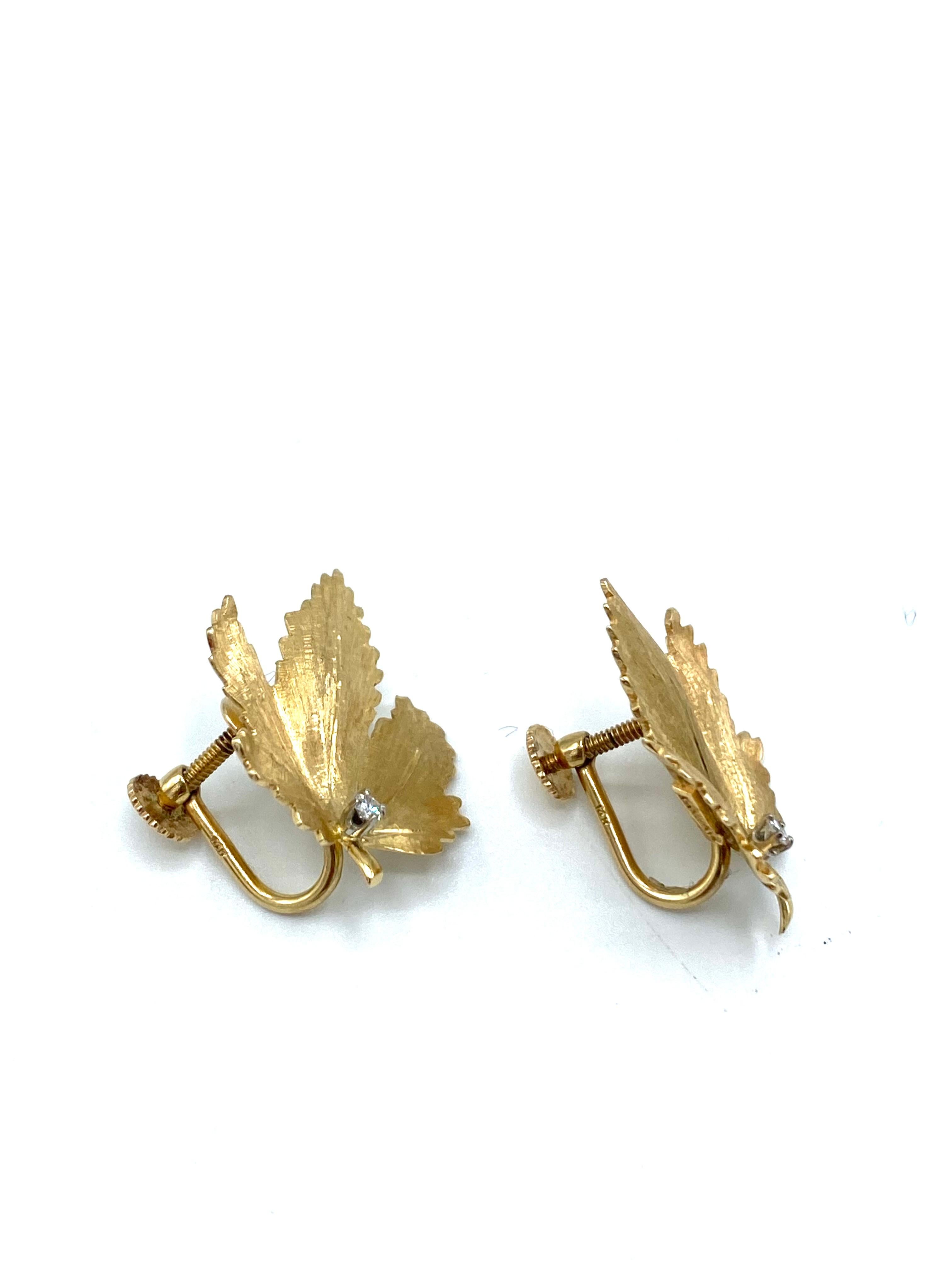 Product details:

The ear earrings are designed by Cartier in New York. They feature 14 karat yellow textured gold with 0.06 cts old European cut diamonds, the earrings shaped as maple leaf and feature screw in closure.
The earrings are signed by