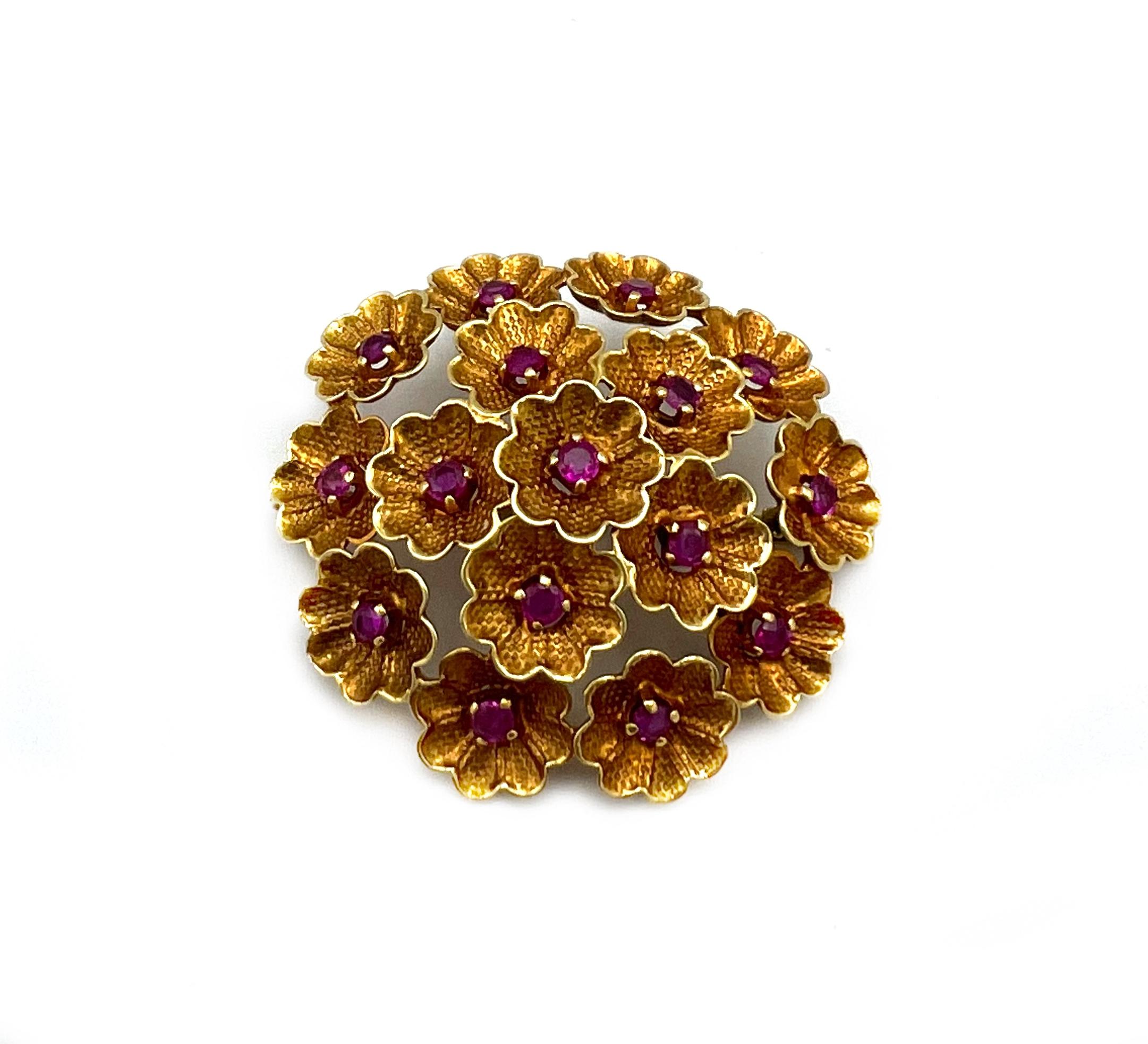 Product details:

The brooch is made out of 18K yellow gold and 0.8 carats of rubies, it features 3D floral motif. Made in Switzerland.

Hallmarks: Cartier Inc, 18Kts, Swiss.
Measurements: 1.25” diameter.
Weight: 8.2 grams.
