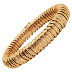Bracciale flessibile d'epoca Cartier in oro giallo, acciaio inossidabile e diamanti