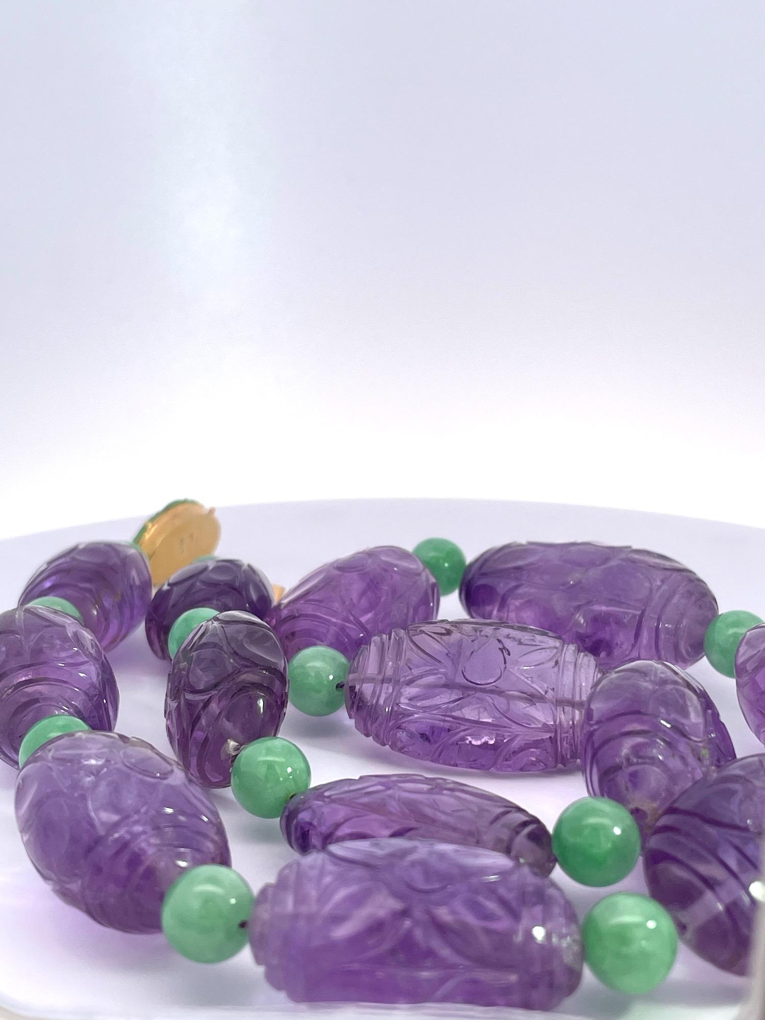 This lovely Amethyst Necklace has detailed carved Amethyst beads.  The length is 19 1/2 