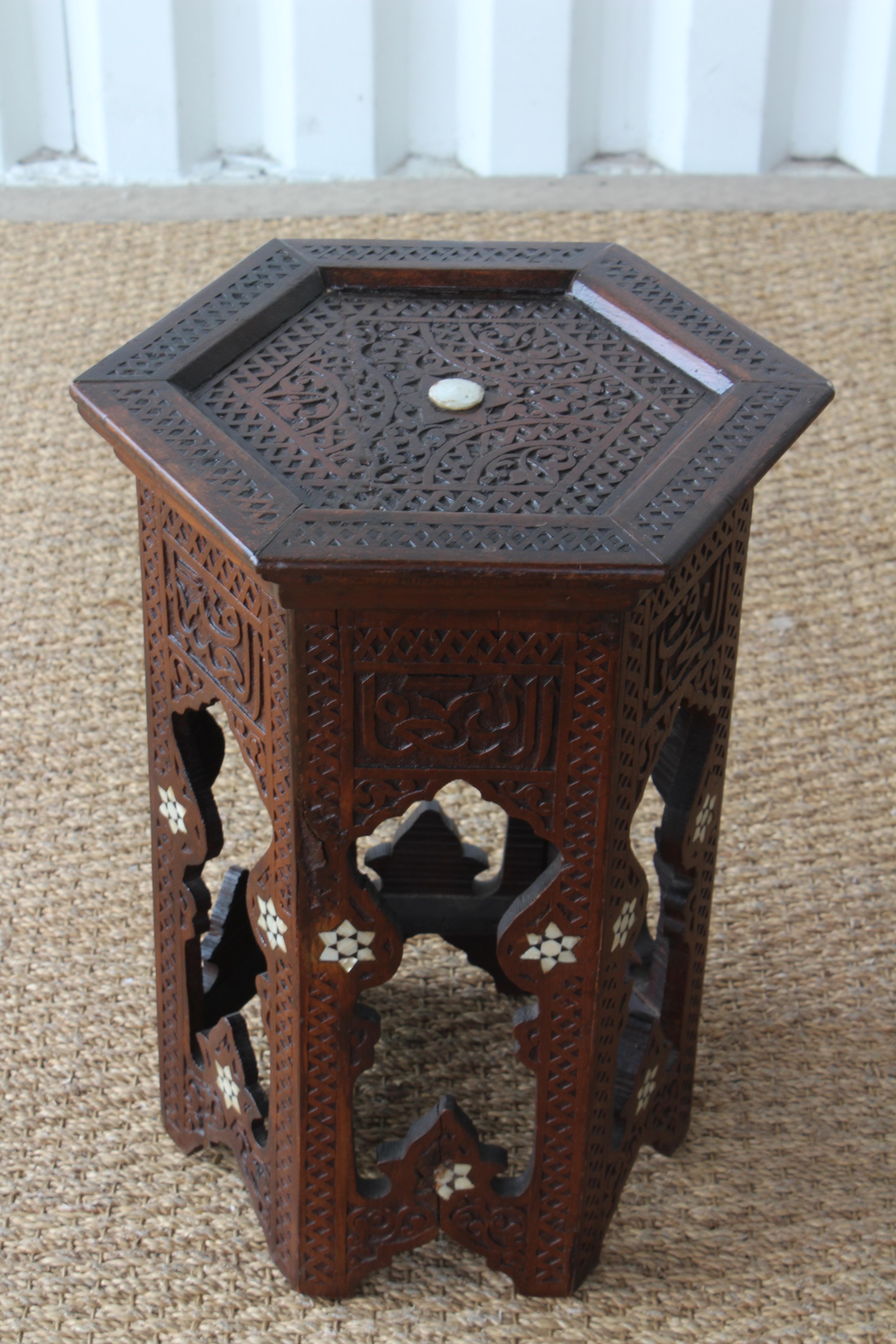 Petite carved walnut side table with pearl inlay. Recently refinished and in excellent condition.